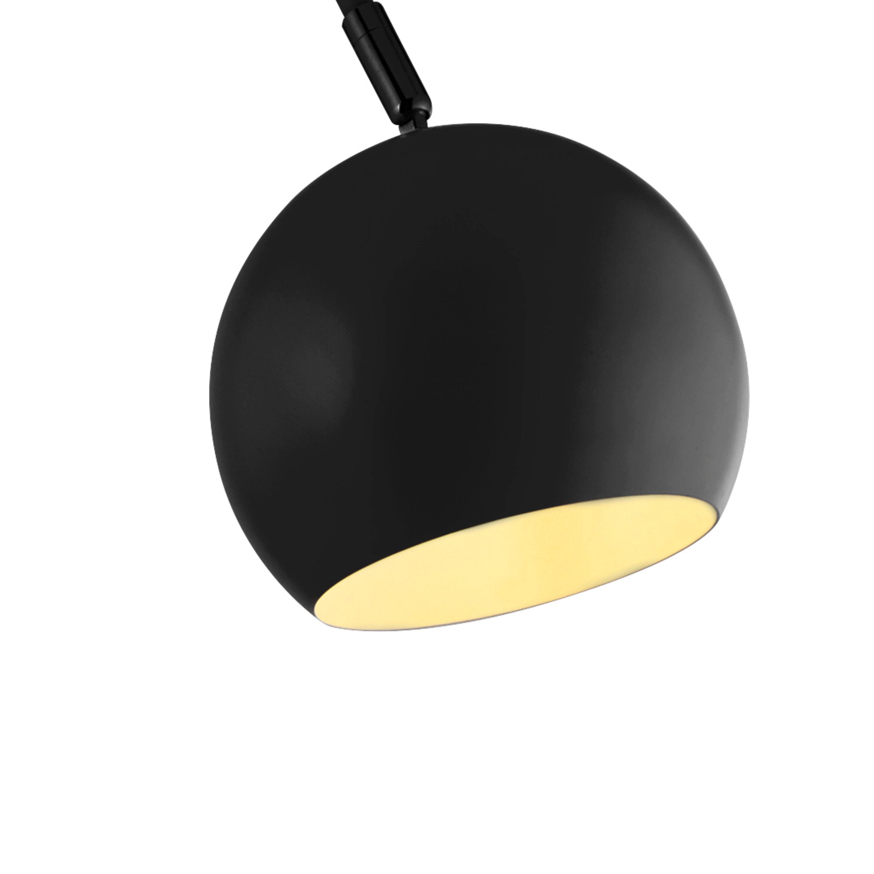 Close up of the Calumn Floor Lamp globe shade showing the matt black exterior and pale interior
