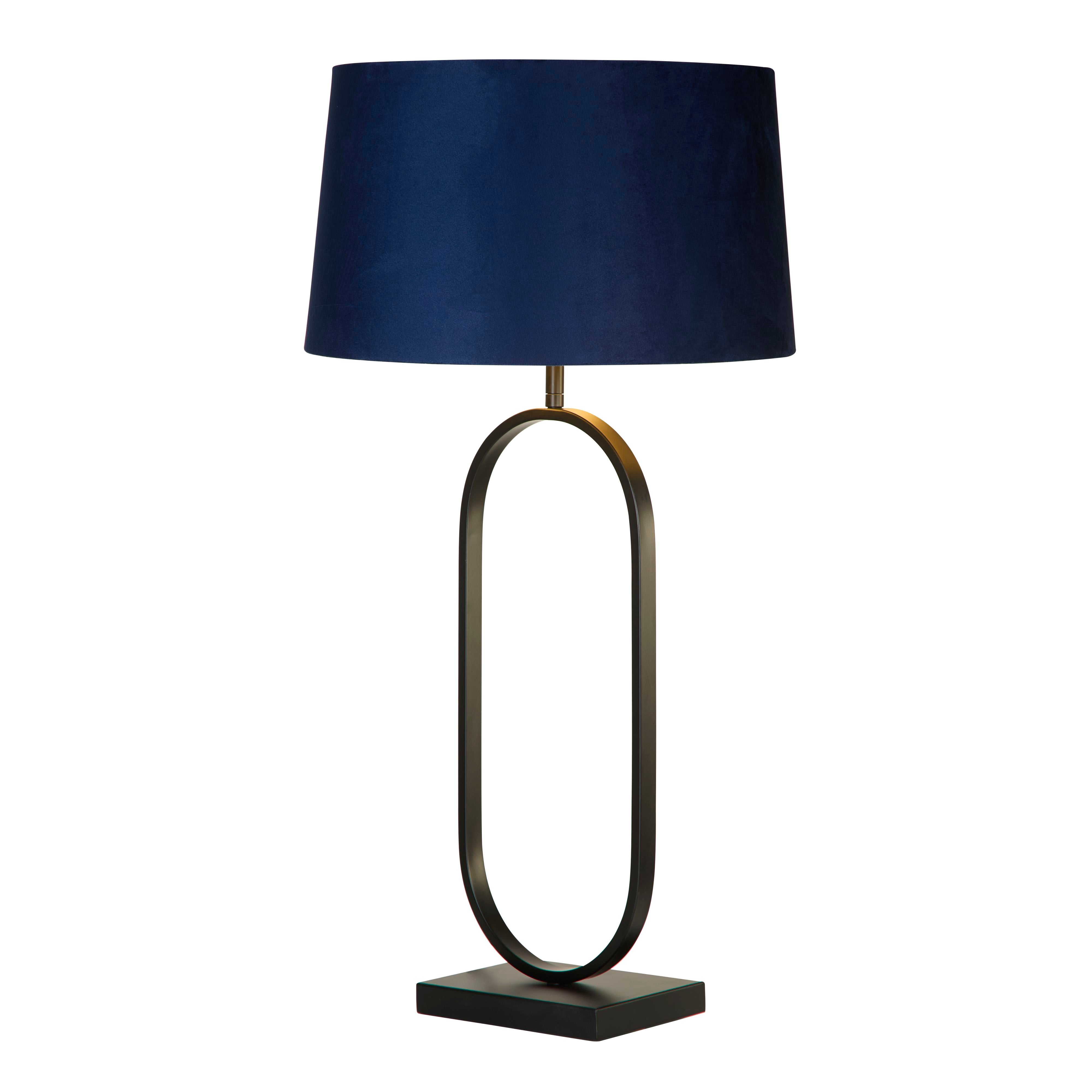 Searchlight Modish table lamp in matt black with a navy velvet shade, angled studio shot showing the tall oval metal base and tapered shade.