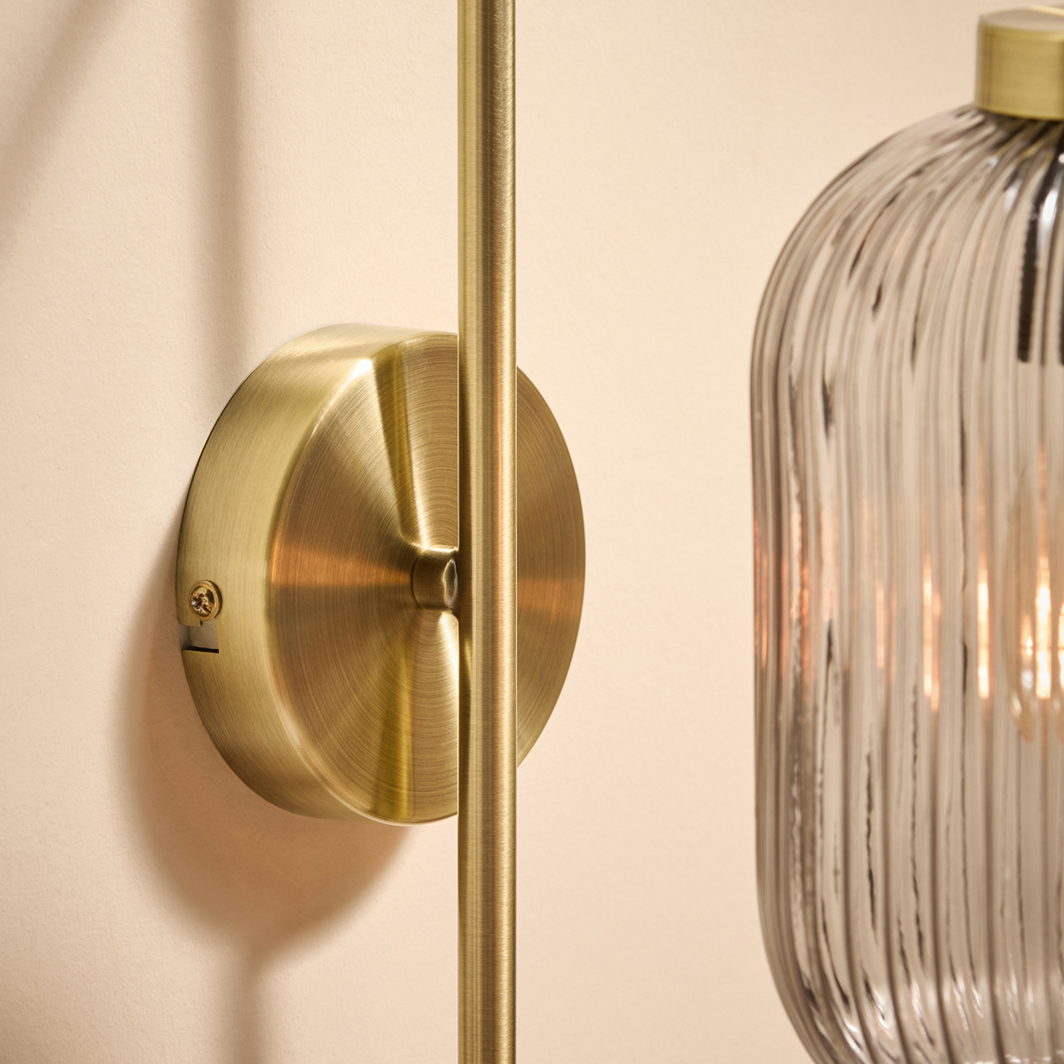 MADE.COM Briz Wall Light in Antique Brass with Ribbed Grey Glass Shade