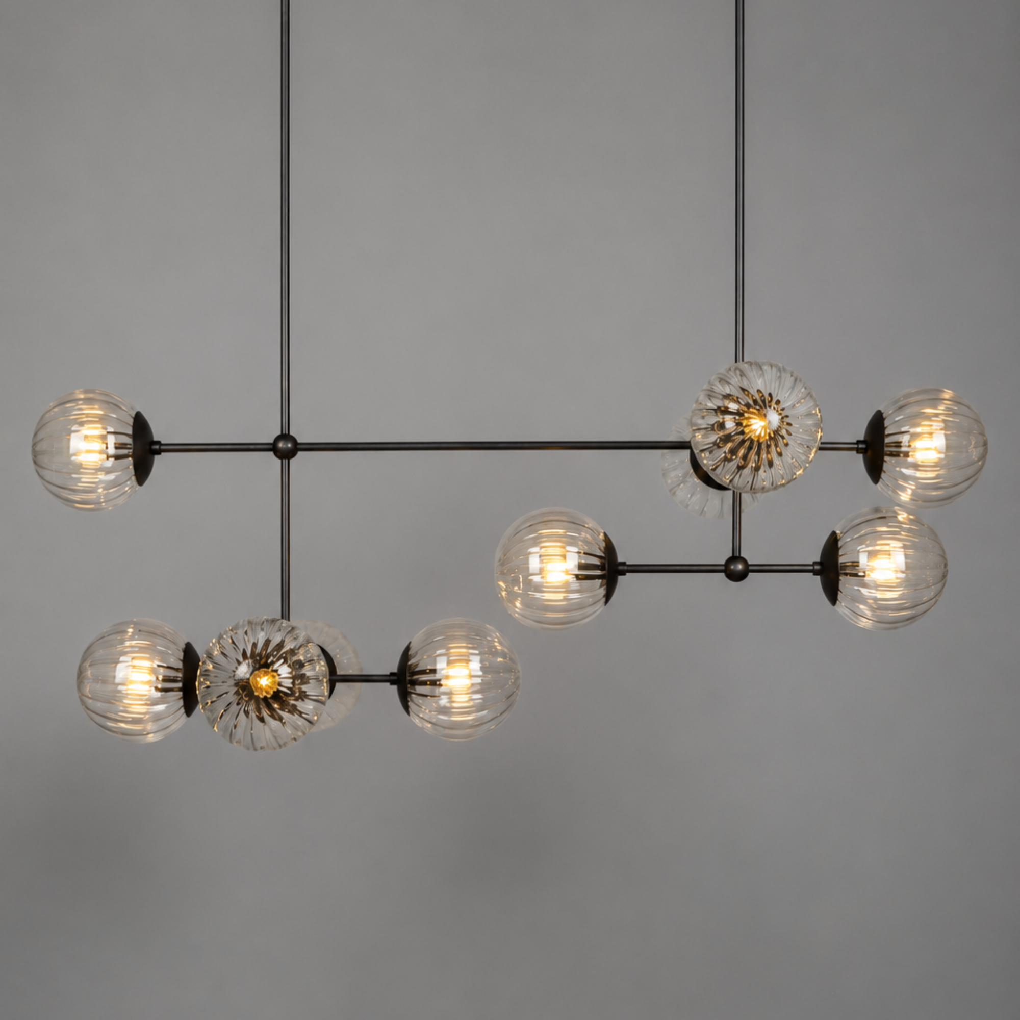 Schwung Armstrong Linear 10 Light Chandelier - Dries Ribbon Glass