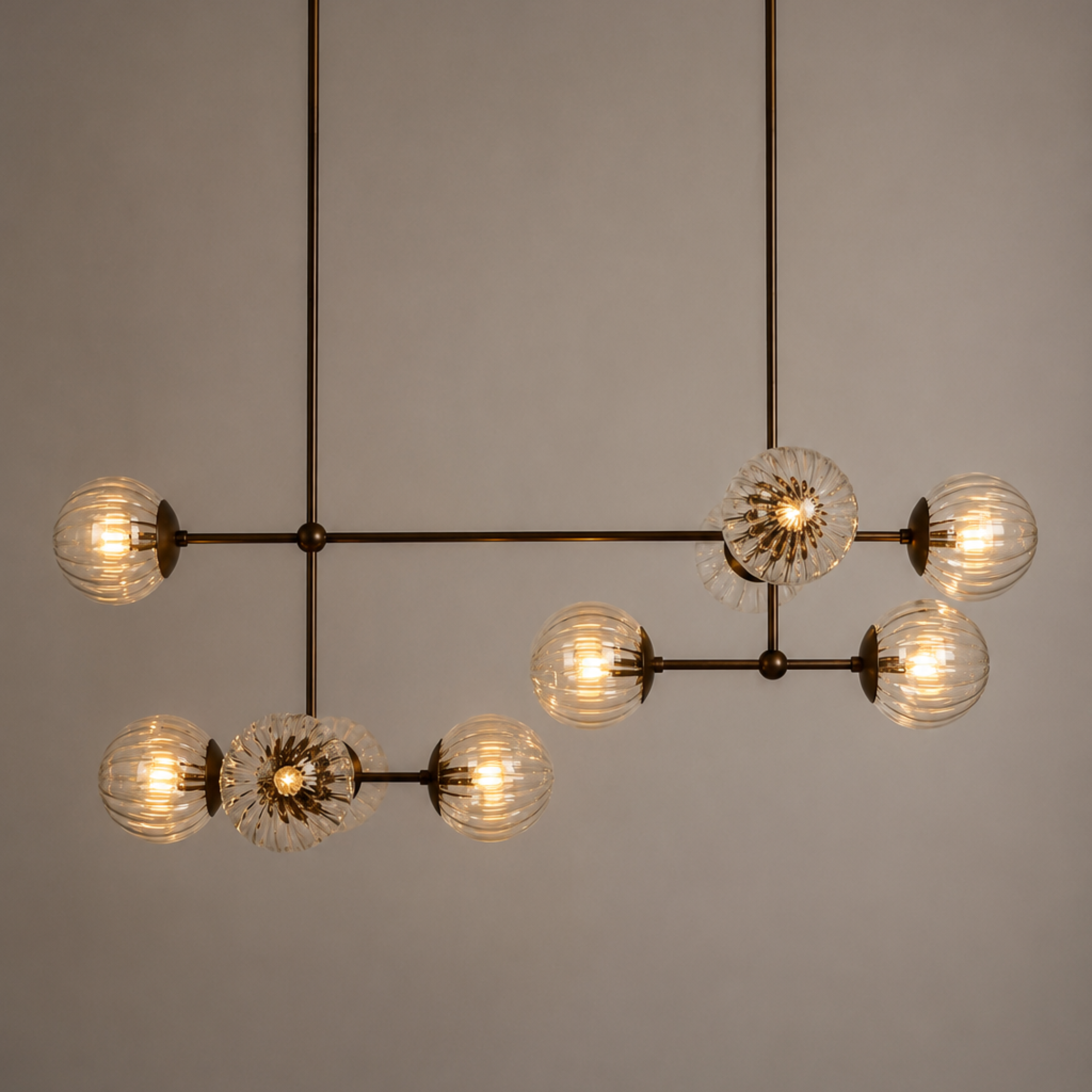 Schwung Armstrong Linear 10 Light Chandelier - Dries Ribbon Glass