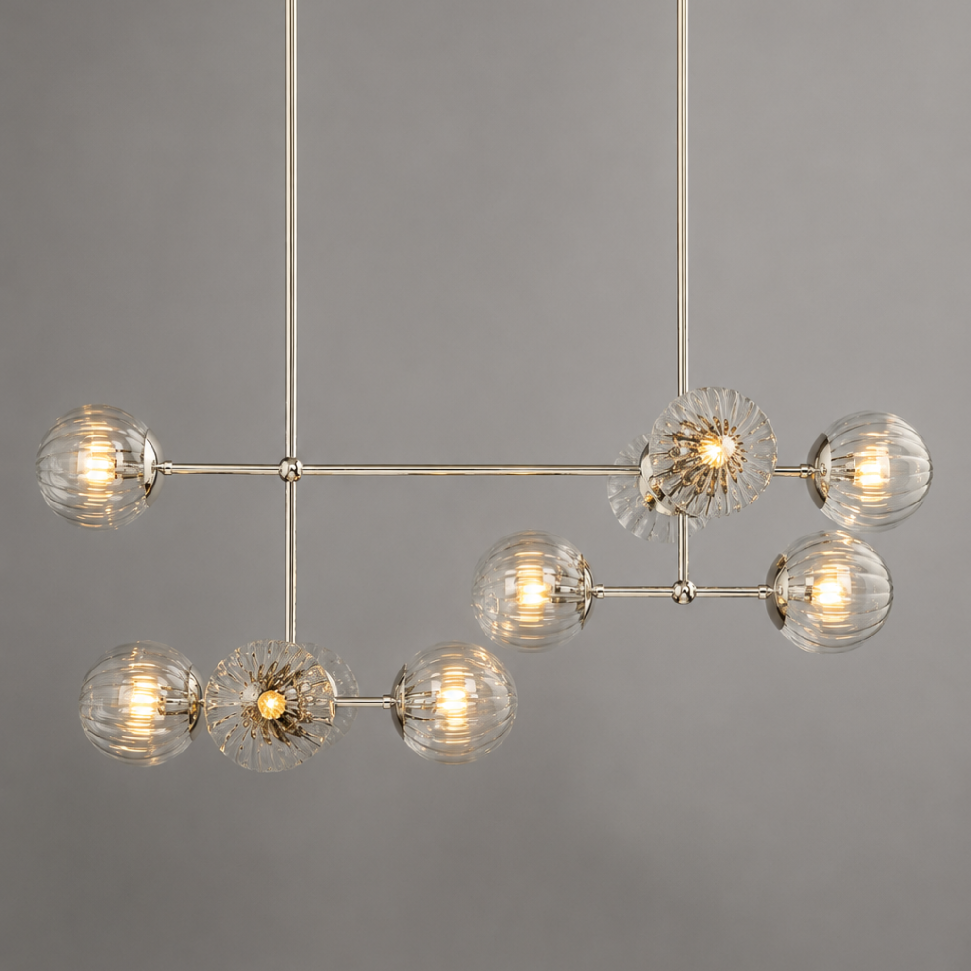 Schwung Armstrong Linear 10 Light Chandelier - Dries Ribbon Glass