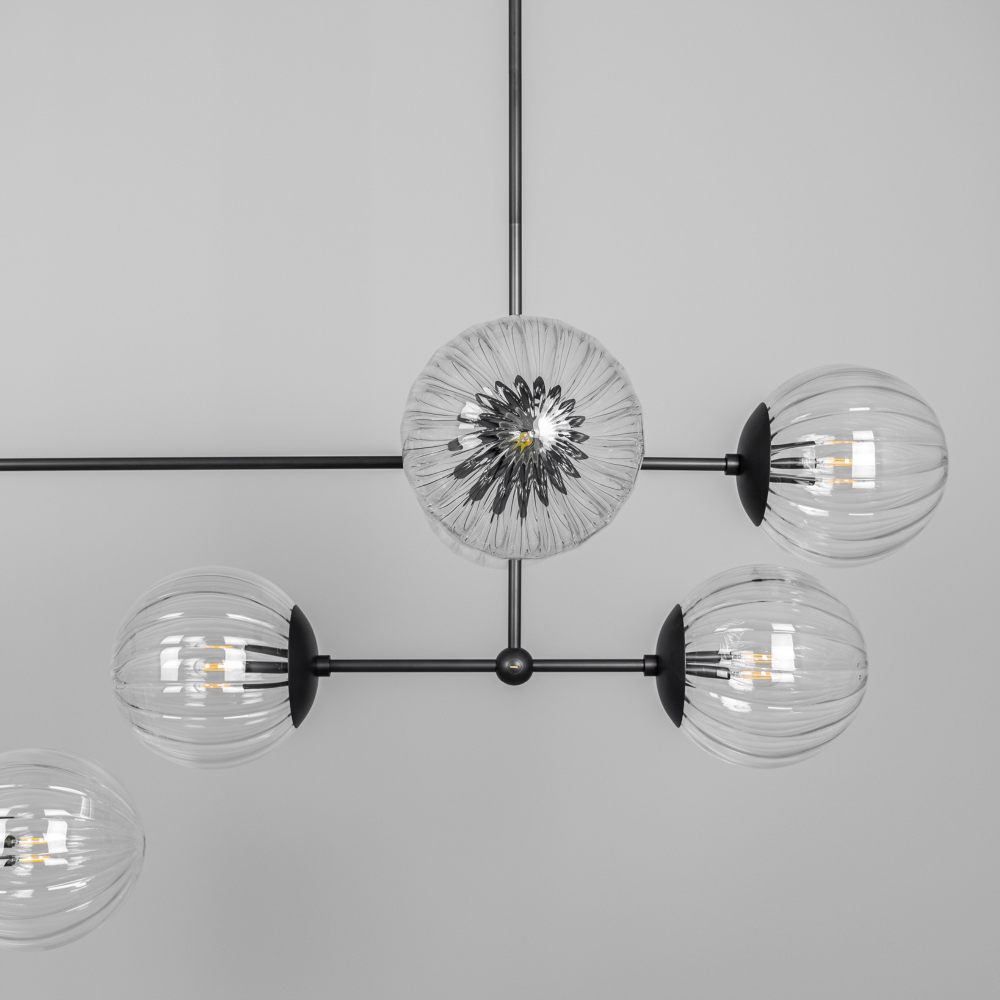 Schwung Armstrong Linear 10 Light Chandelier - Dries Ribbon Glass