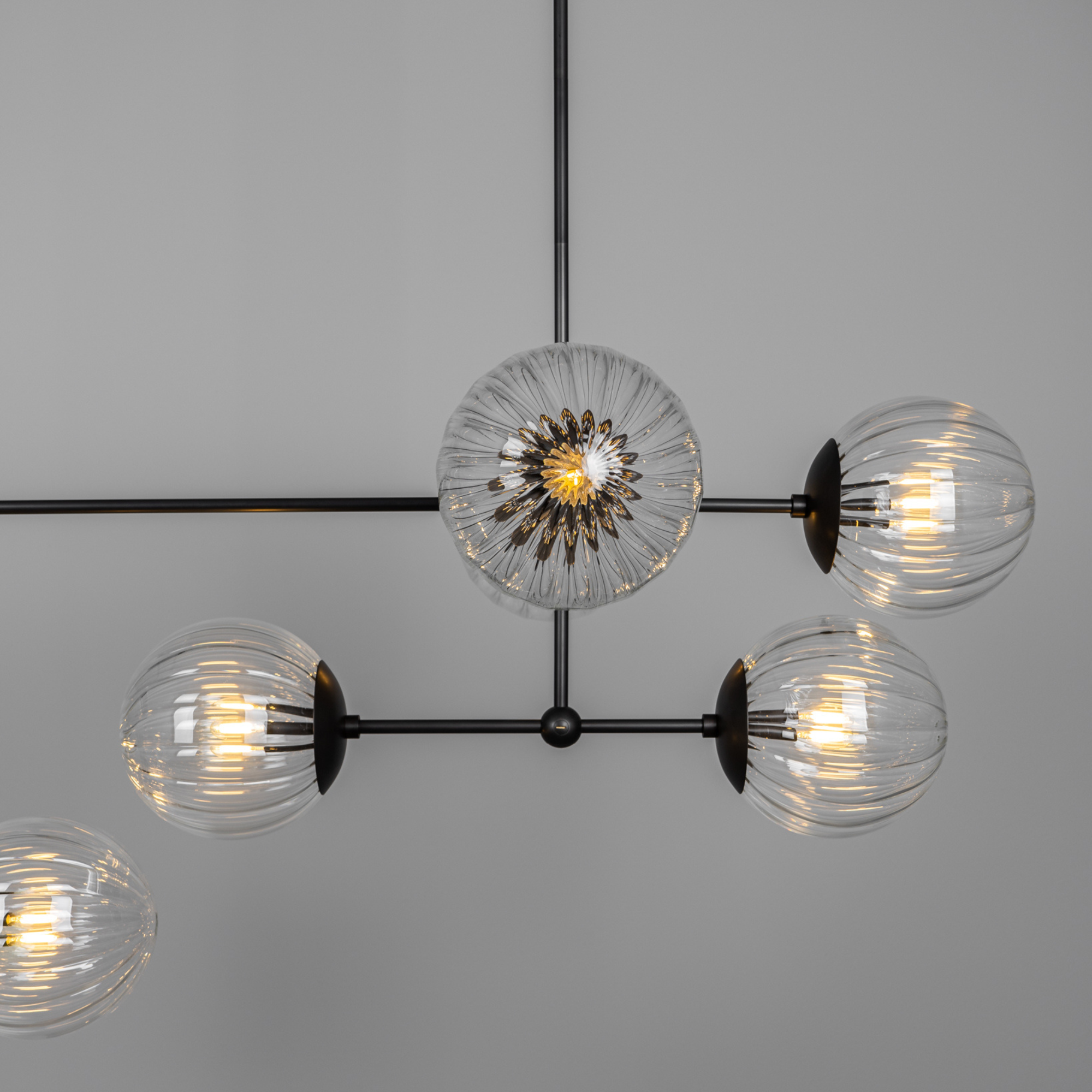 Schwung Armstrong Linear 10 Light Chandelier - Dries Ribbon Glass