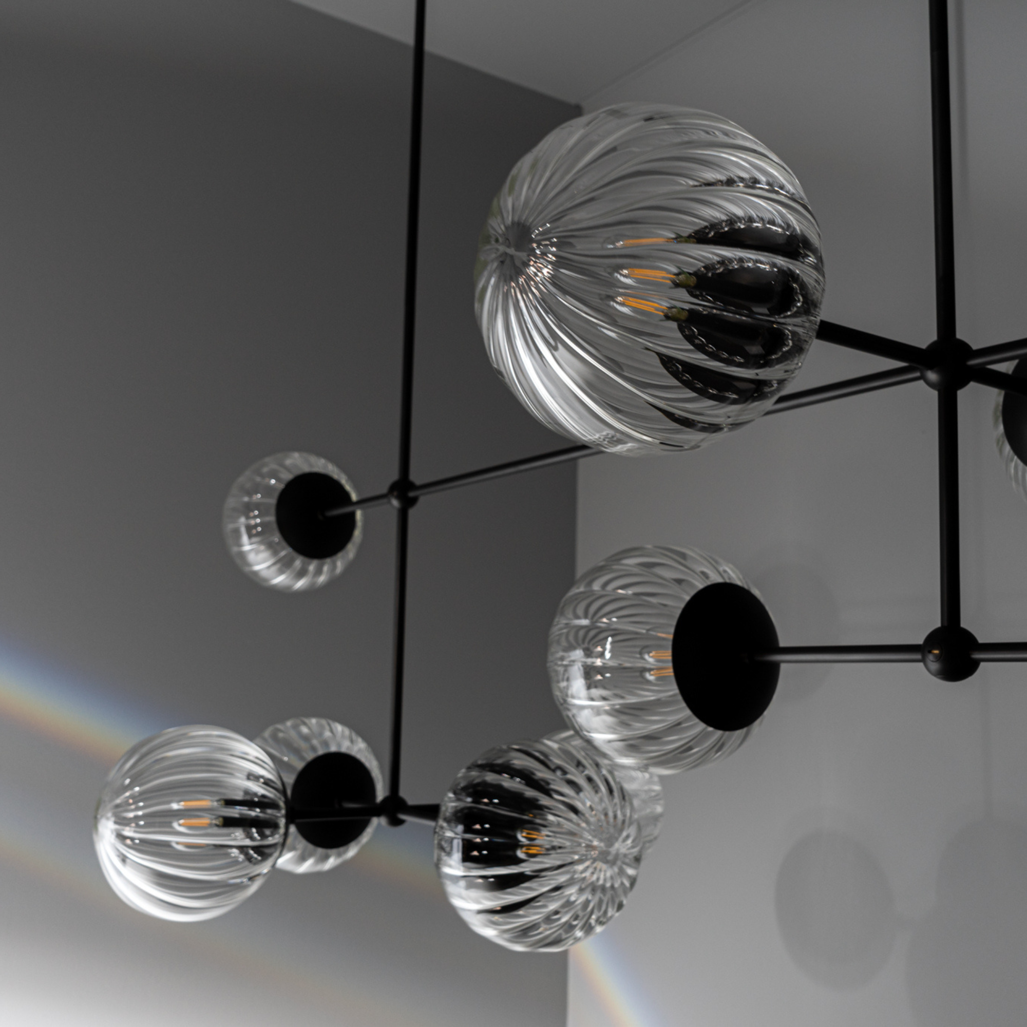 Schwung Armstrong Linear 10 Light Chandelier - Dries Ribbon Glass