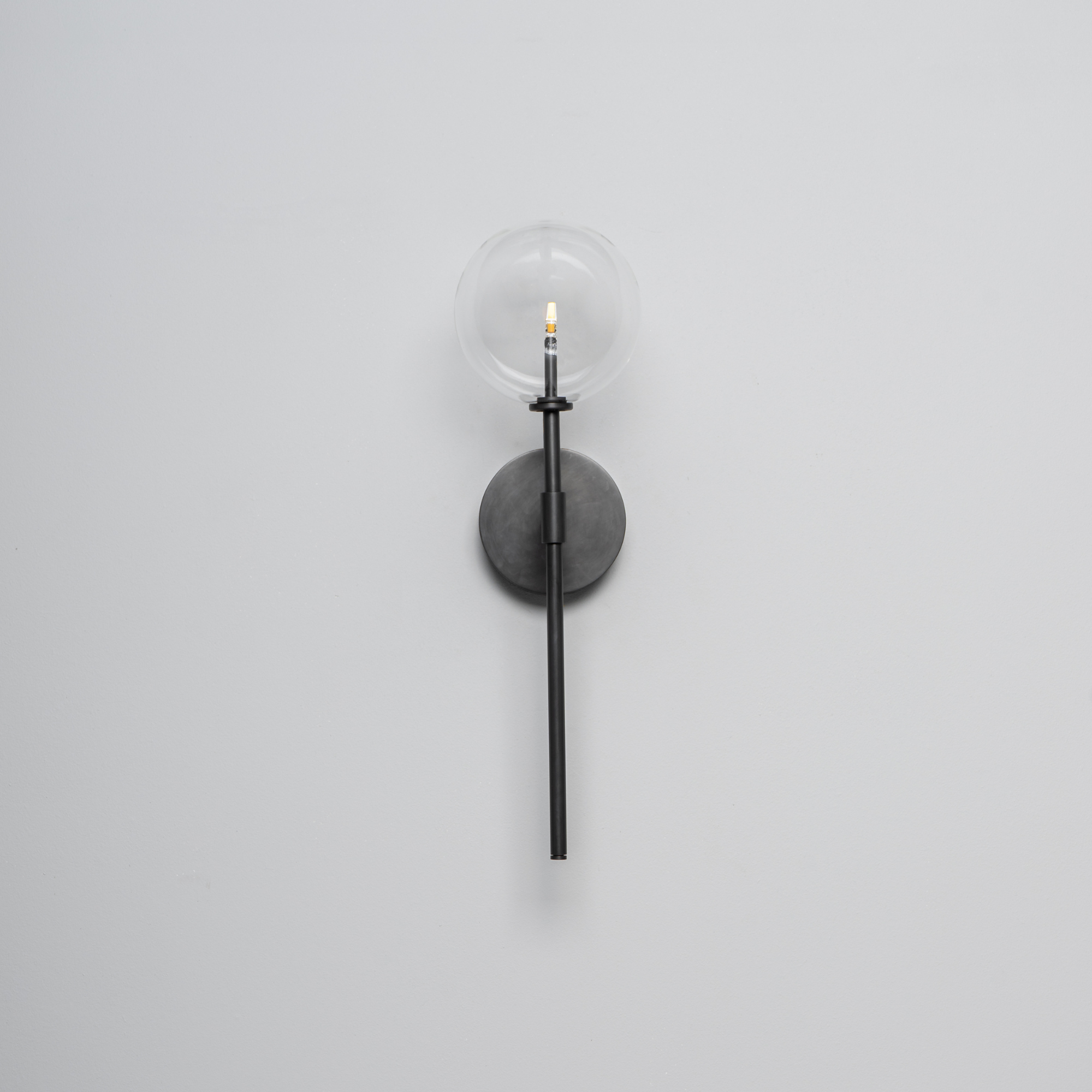 Schwung Dawn Single Wall Sconce Light - Transparent Glass
