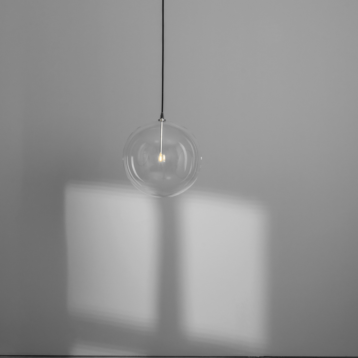 Schwung Glass Globe Single Pendant - Transparent Glass