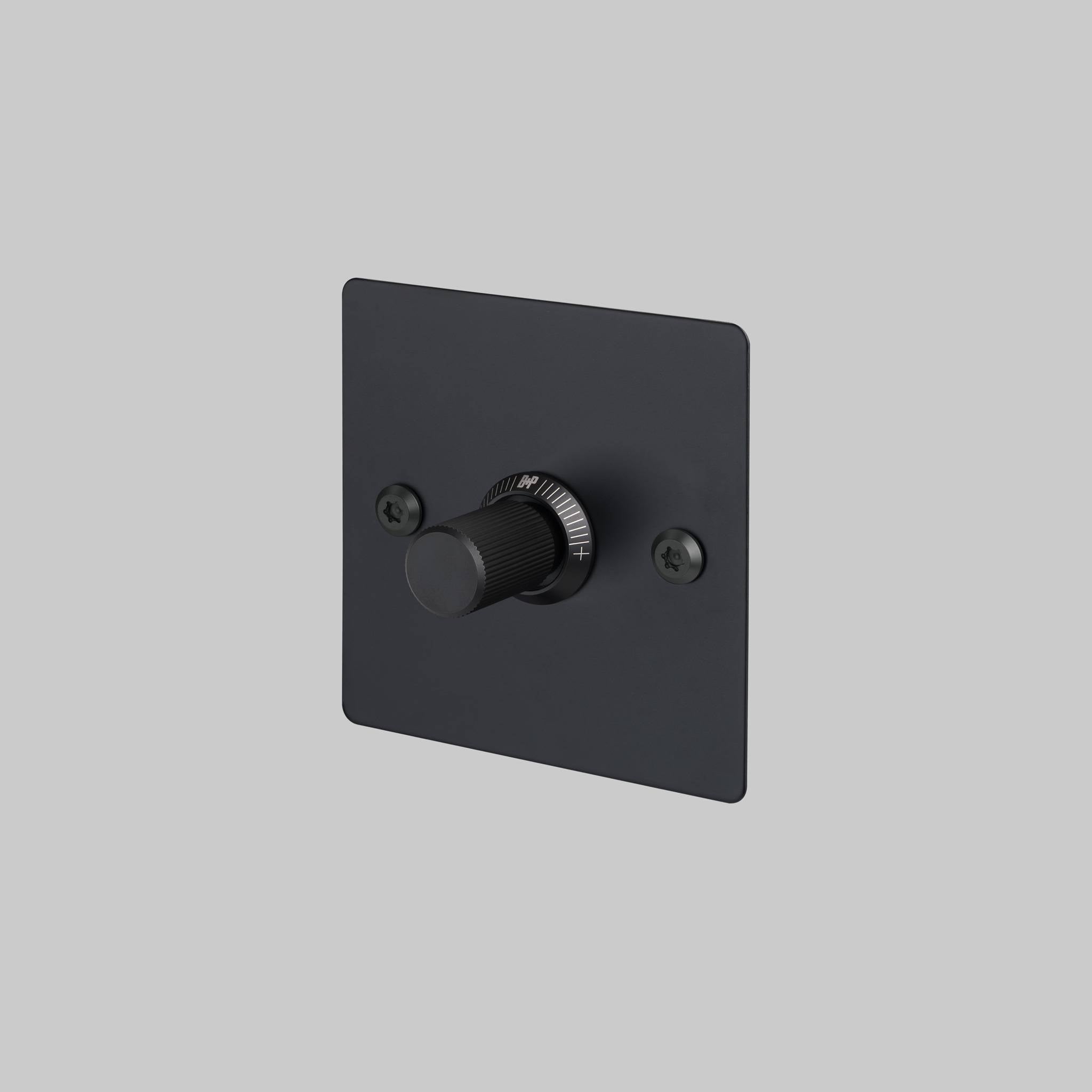 Buster + Punch 1G dimmer switch, black plate with black linear knurl knob, front view
