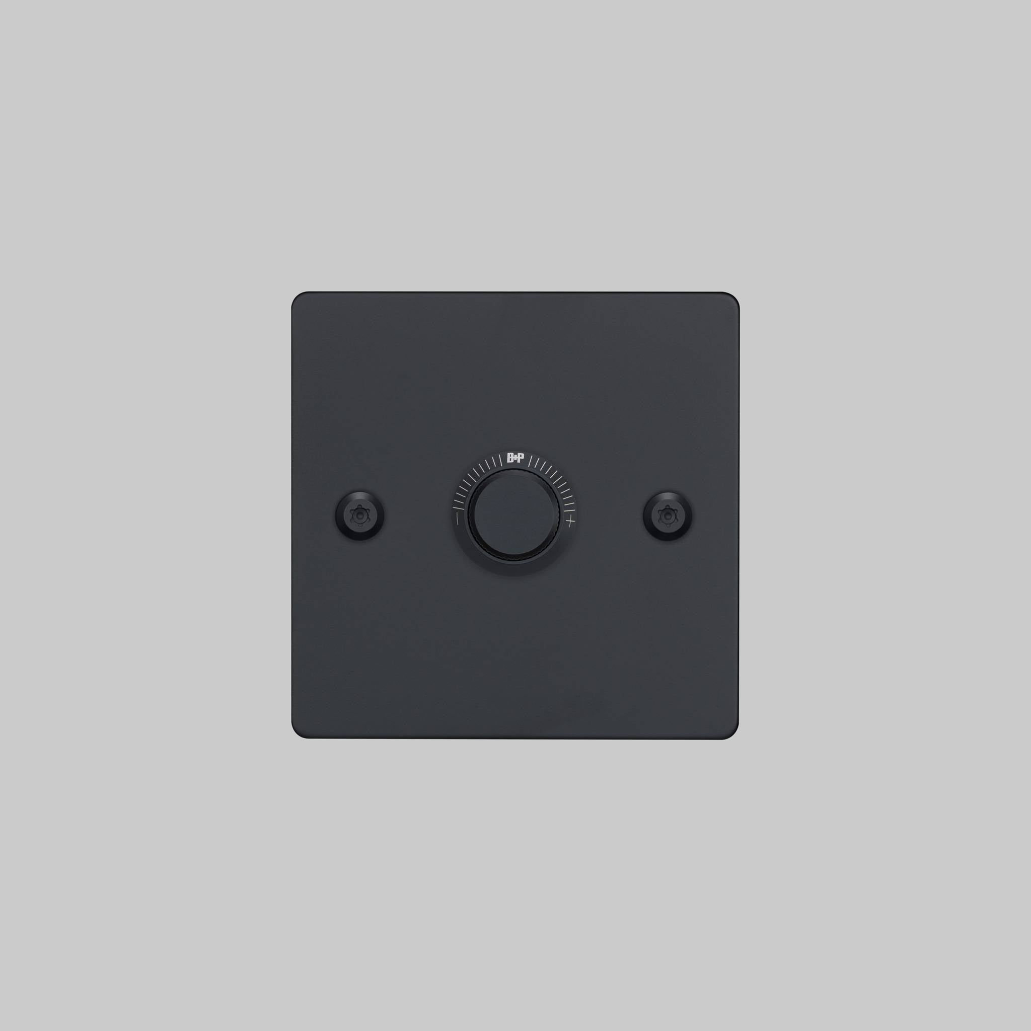 Buster + Punch 1G dimmer switch, black plate with black linear knurl knob, elevated angle