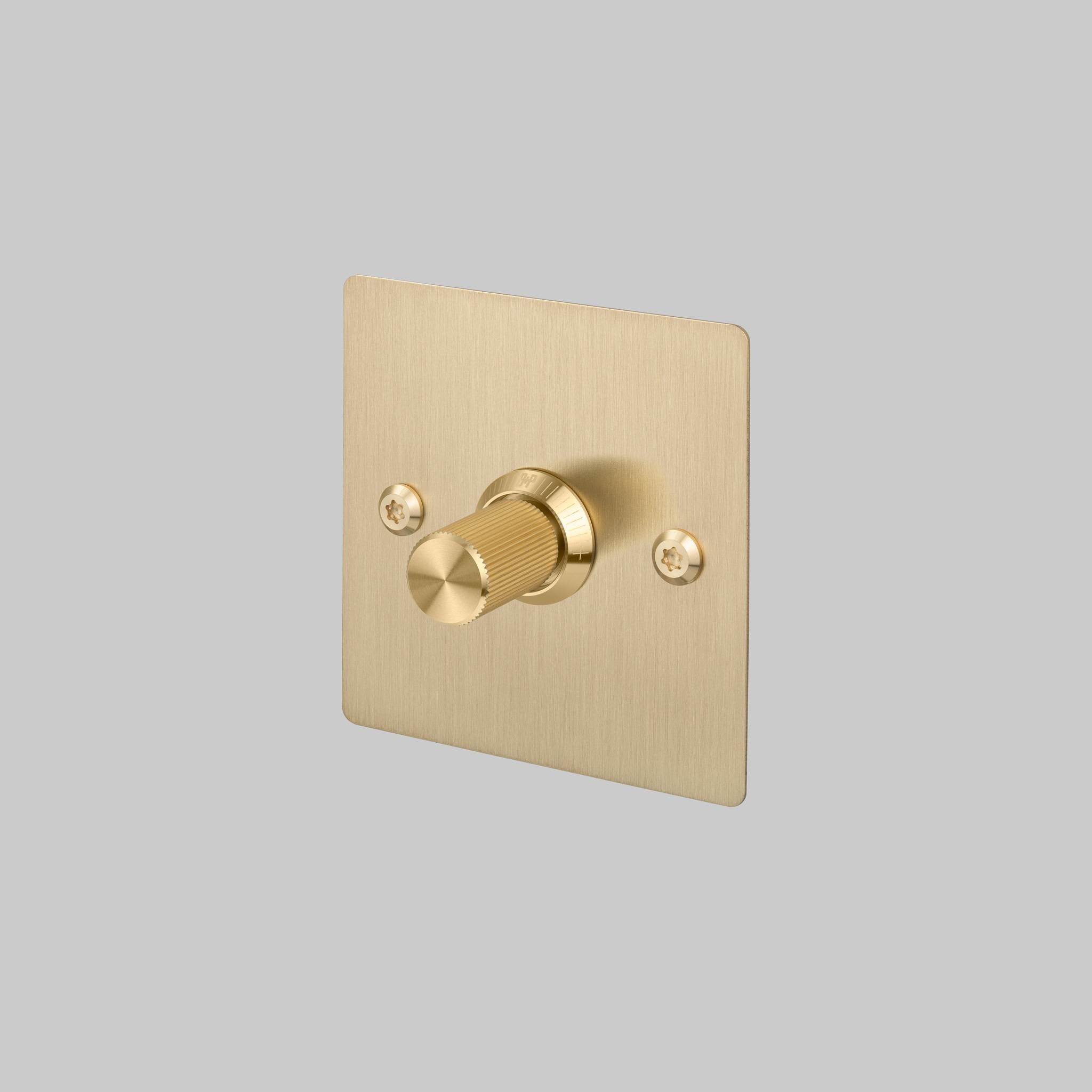 Buster + Punch 1G Dimmer switch, Brass plate with Brass linear knurl knob, front view