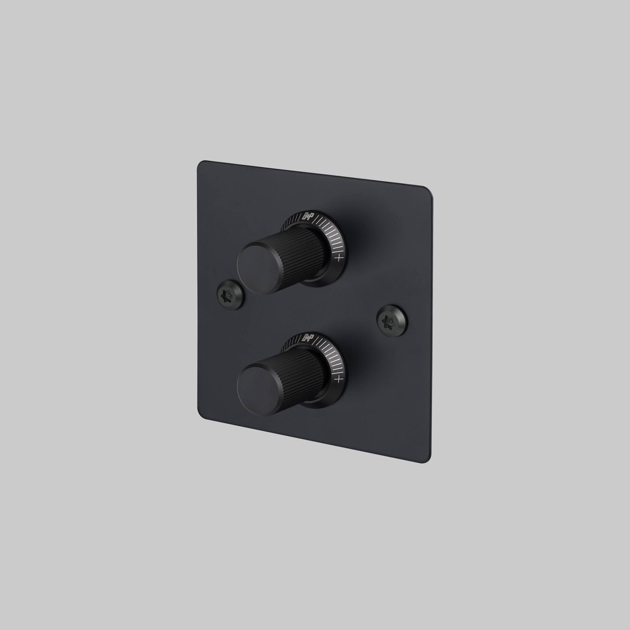 Buster + Punch 2G dimmer switch, black plate with black linear knurl knobs, front view