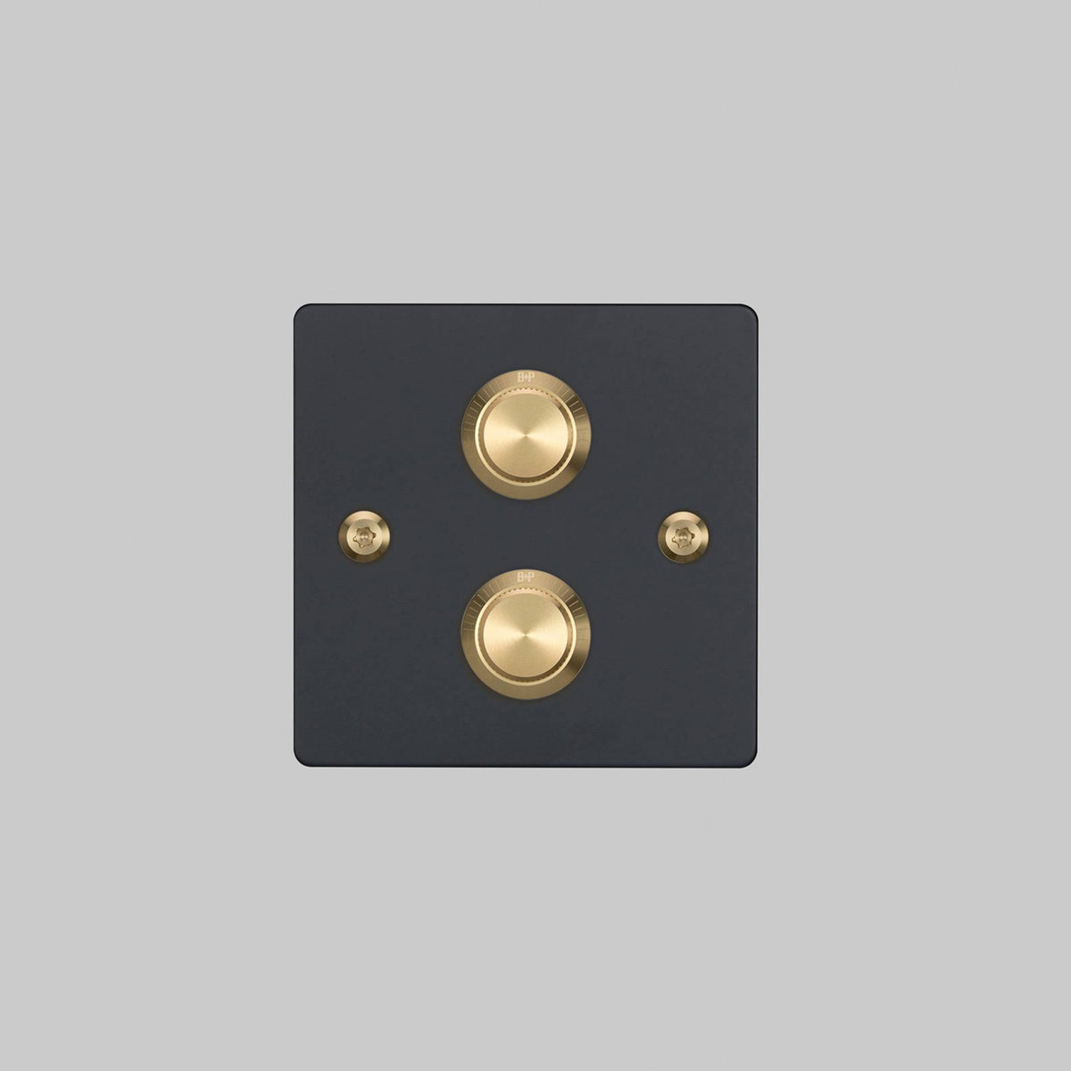 Buster + Punch 2G dimmer switch, black plate with brass linear knurl knobs, front elevation