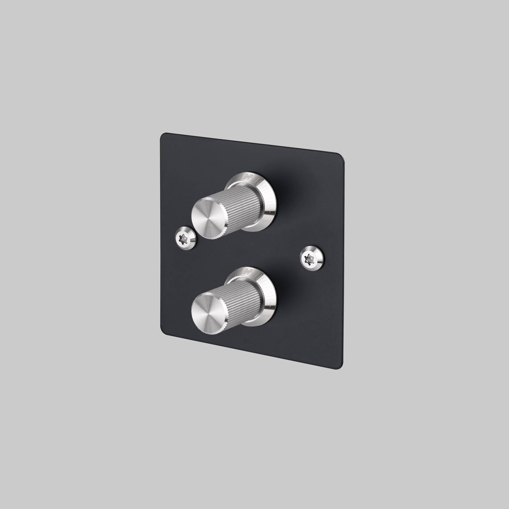 Buster + Punch 2G dimmer switch, black plate with steel linear knurl knobs, front view