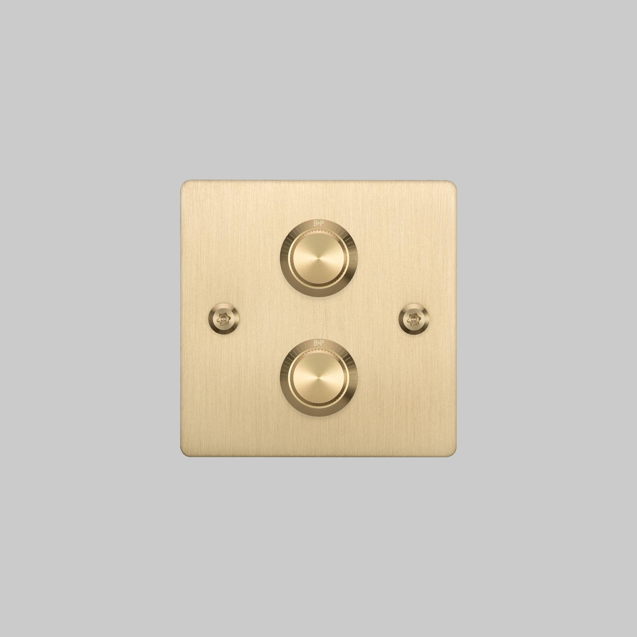 Buster + Punch 2G dimmer switch, brass plate with brass linear knurl knobs, front elevation