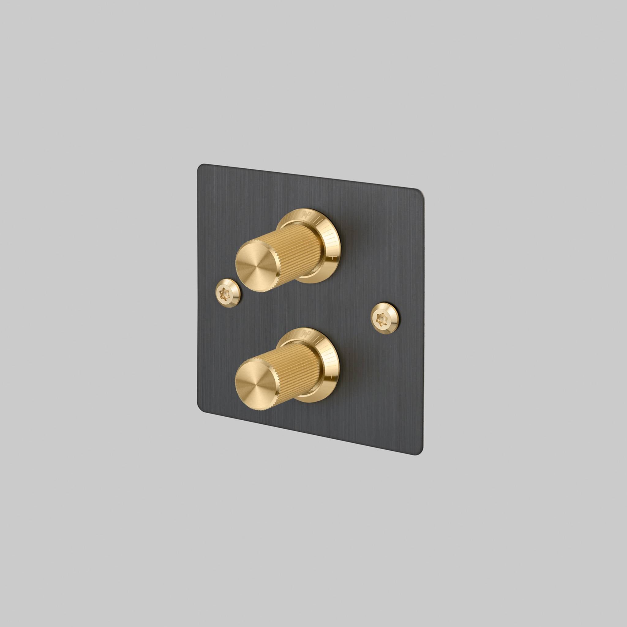 Buster + Punch 2G dimmer switch, smoked bronze plate with brass linear knurl knobs, front view