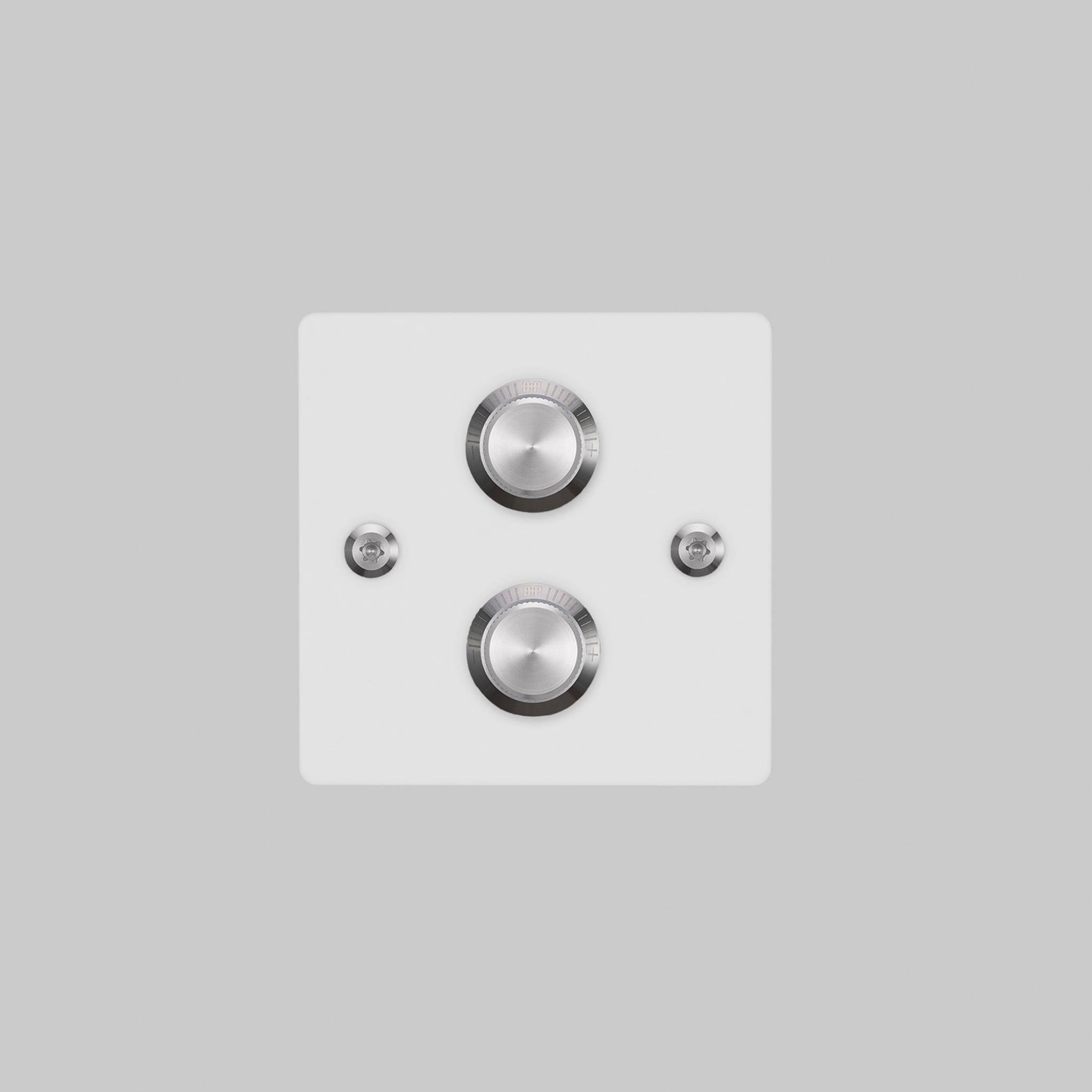 Buster + Punch 2G dimmer switch, white plate with steel linear knurl knob, elevated angle view