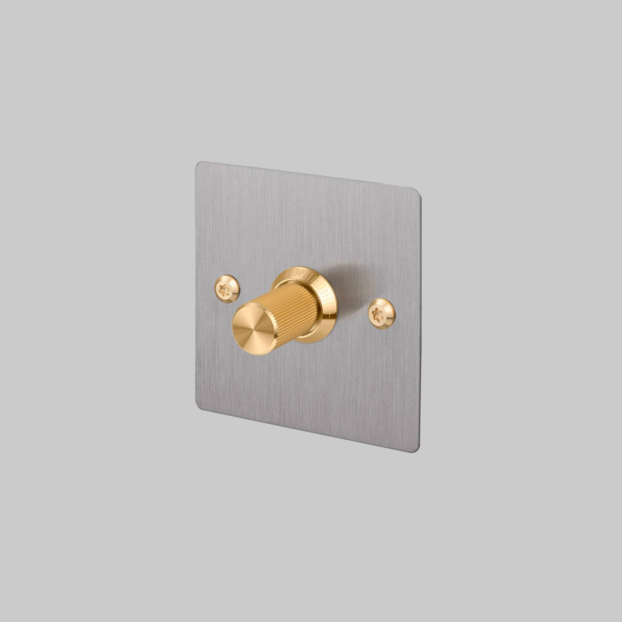 Buster + Punch 1G Dimmer switch, Steel plate with Brass linear knurl knob, front view