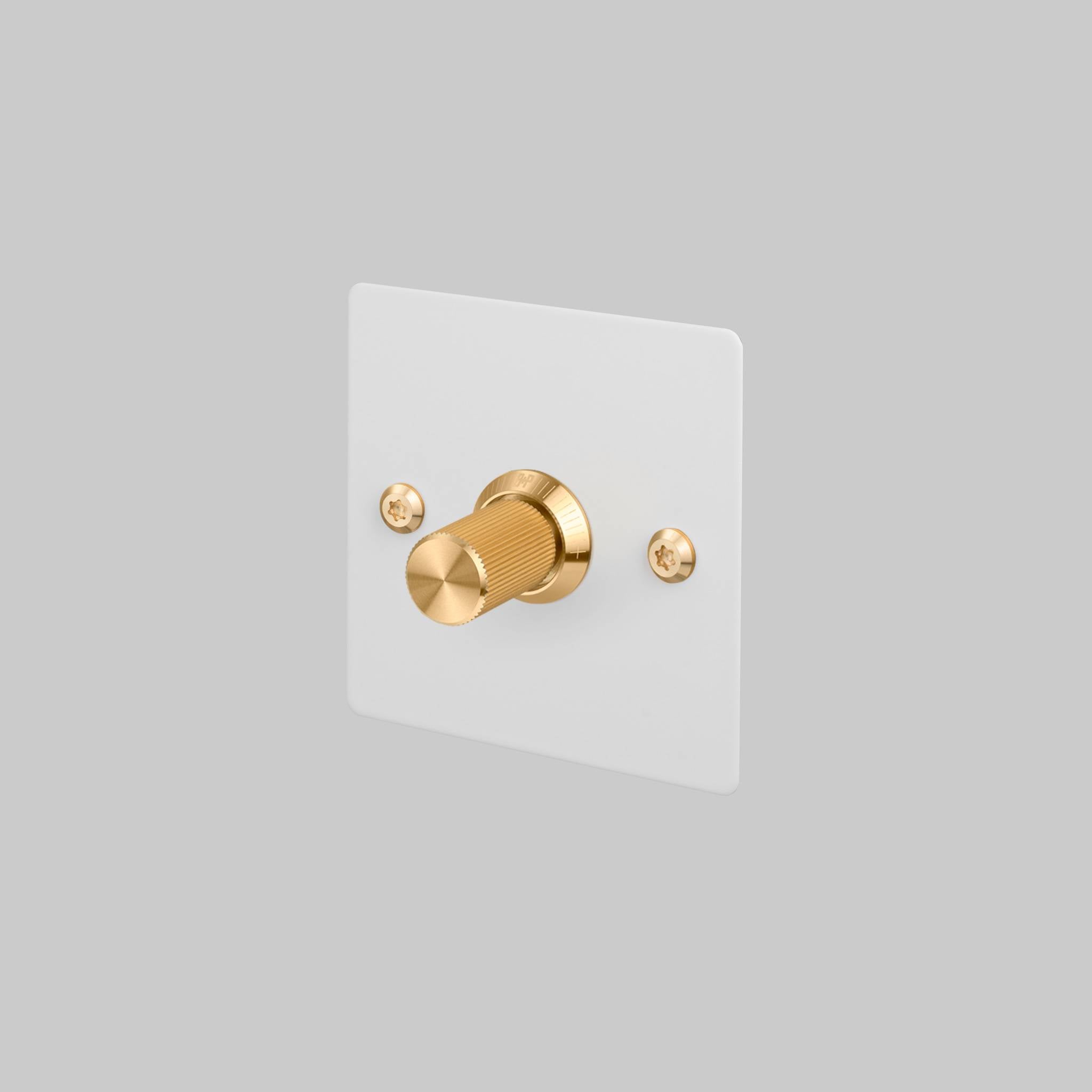 Buster + Punch 1G Dimmer switch, White plate with Brass linear knurl knob, front view