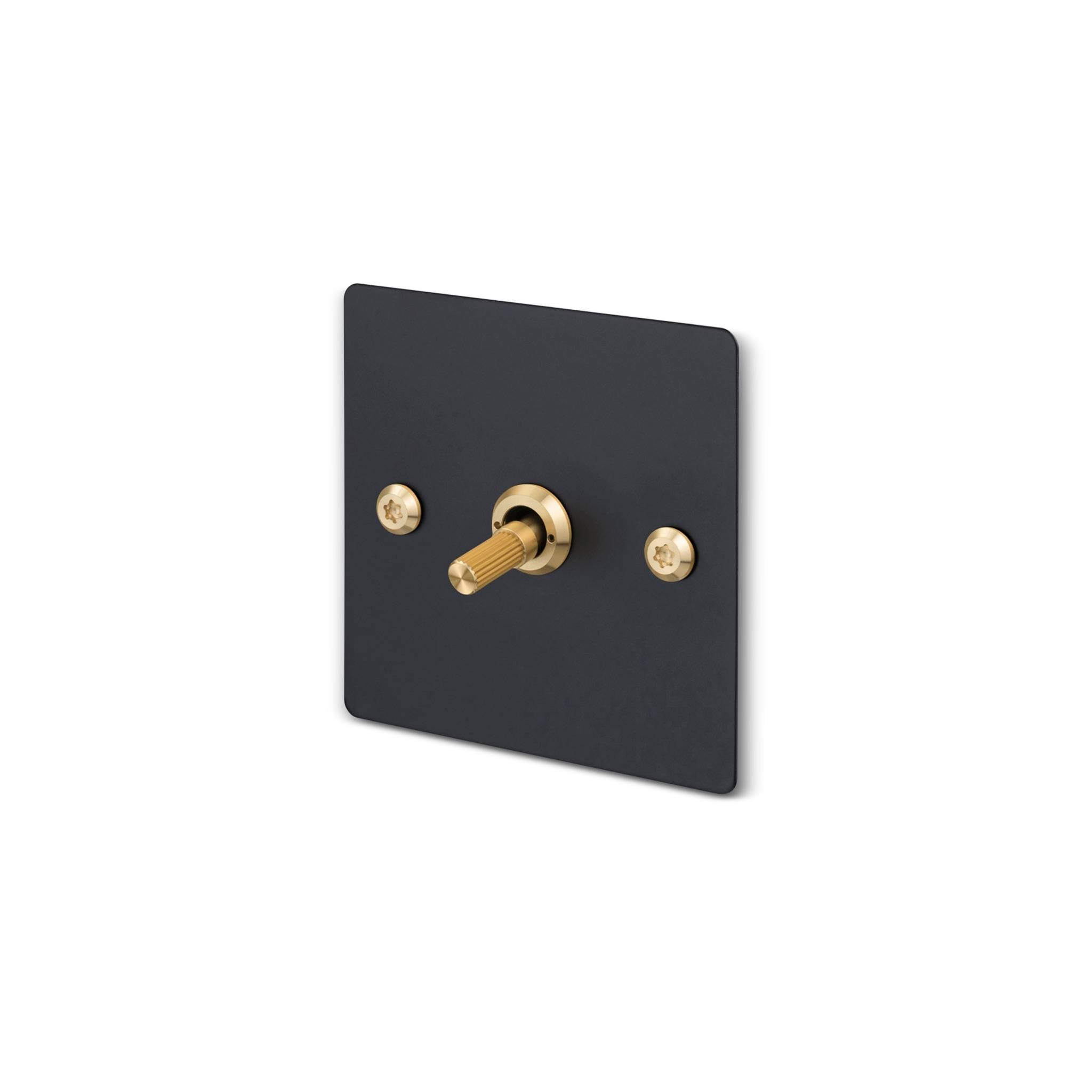 Buster + Punch 1G 2 way toggle switch, Black plate with Brass linear knurl toggle arm, isolated cutout