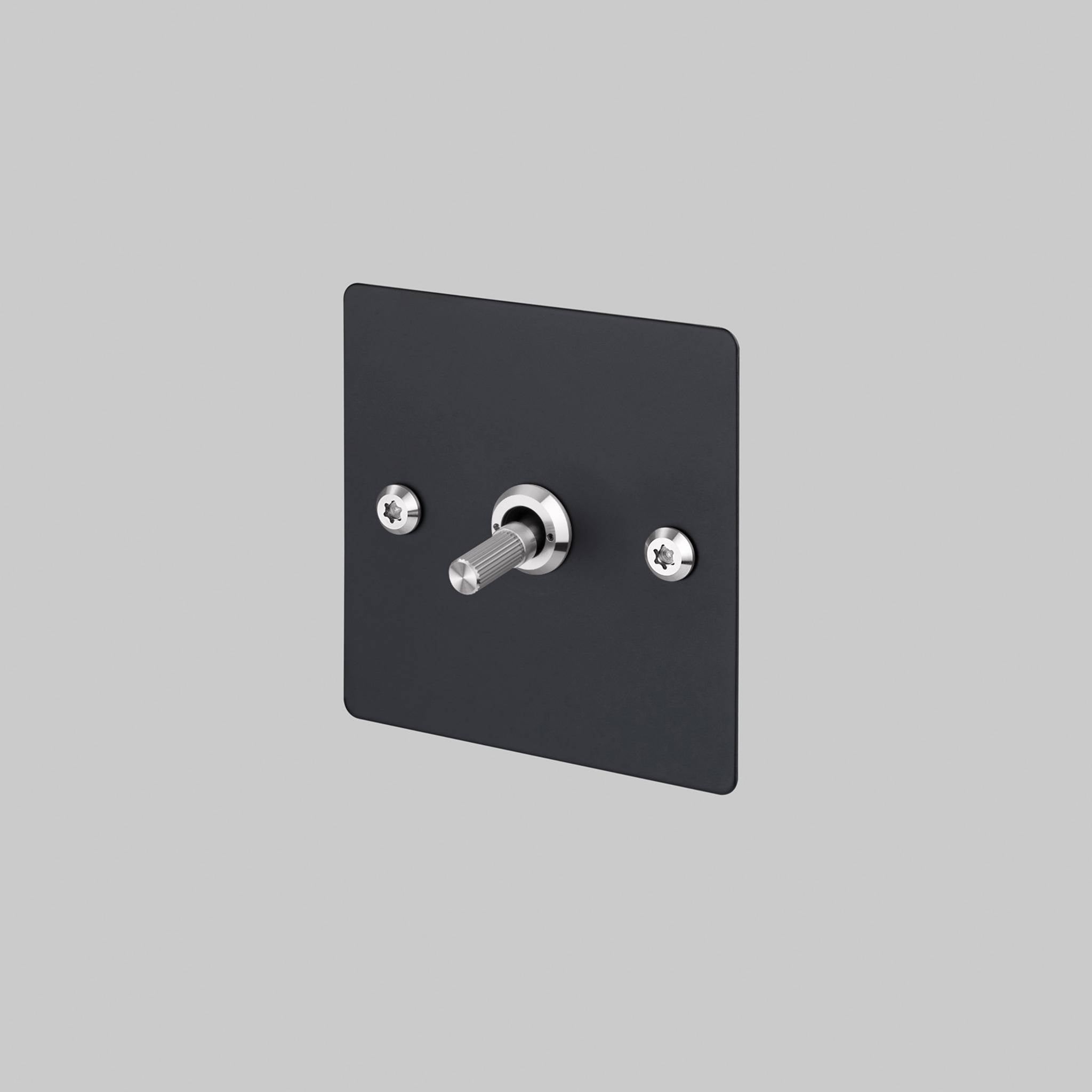 Buster + Punch 1G 2 way toggle switch, Black plate with Steel linear knurl toggle arm, front view