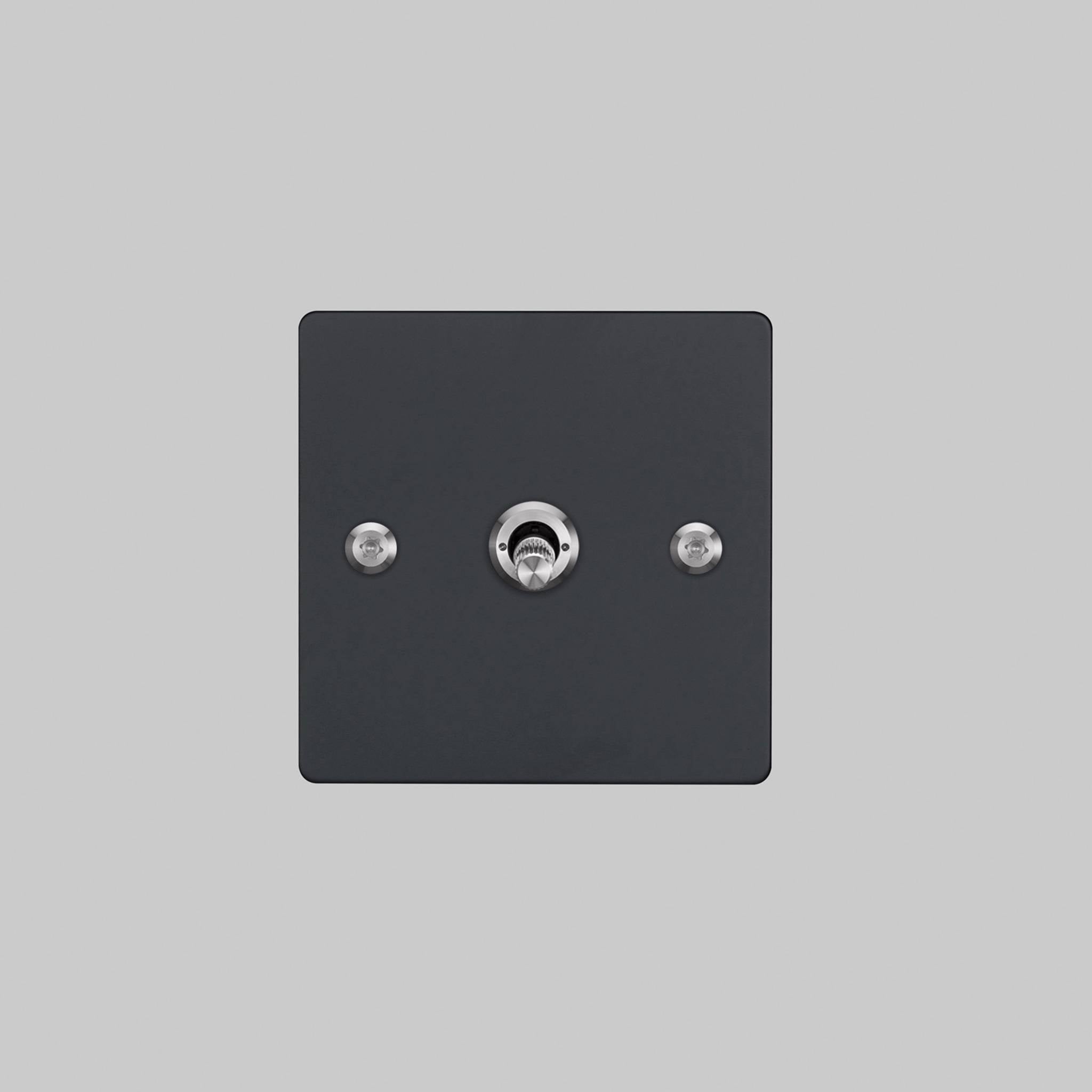 Buster + Punch 1G 2 way toggle switch, Black plate with Steel linear knurl toggle arm, elevated angle