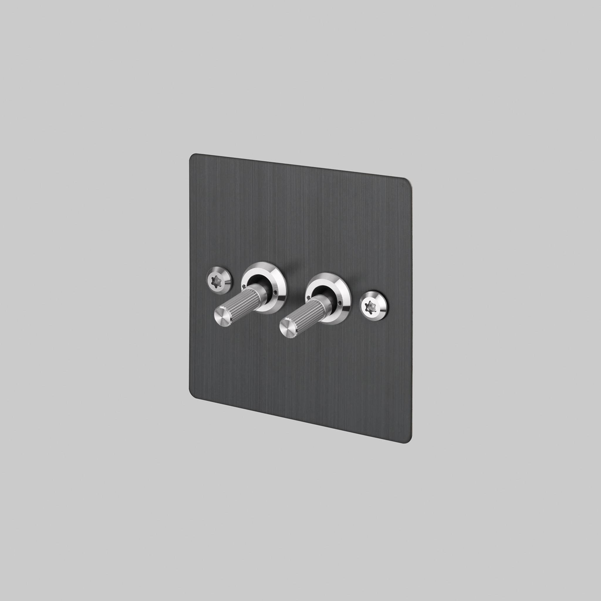 Buster + Punch 2G 2-way toggle switch, smoked bronze plate with steel linear knurl toggle arm, front view