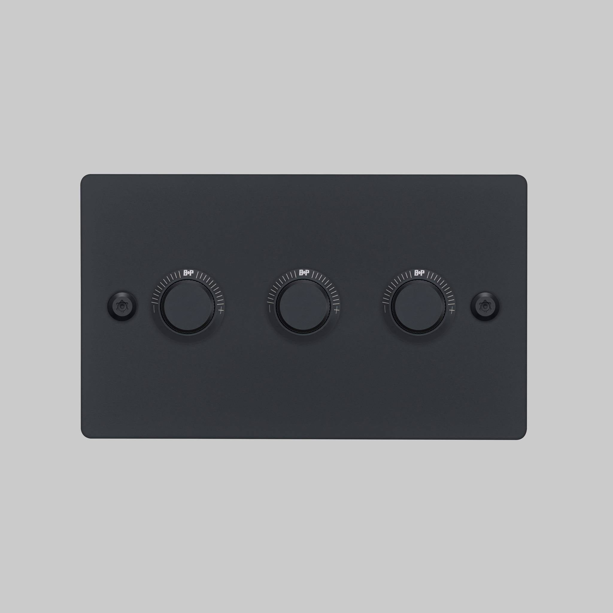 Buster + Punch 3G dimmer switch, black plate with black linear knurl knobs, elevated angle view