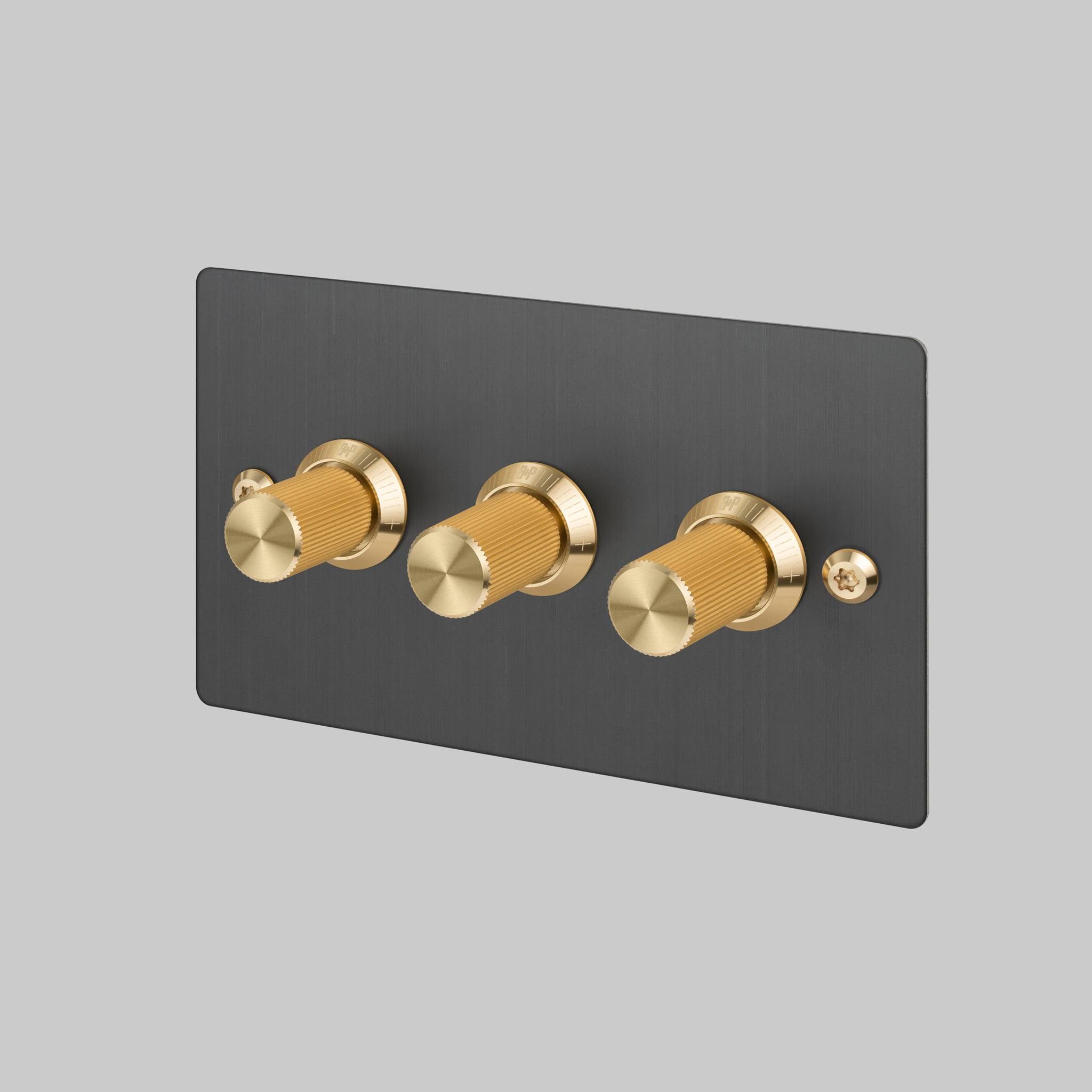 Buster + Punch 3G dimmer switch, Smoked Bronze plate with Brass linear knurl knob, front angled view