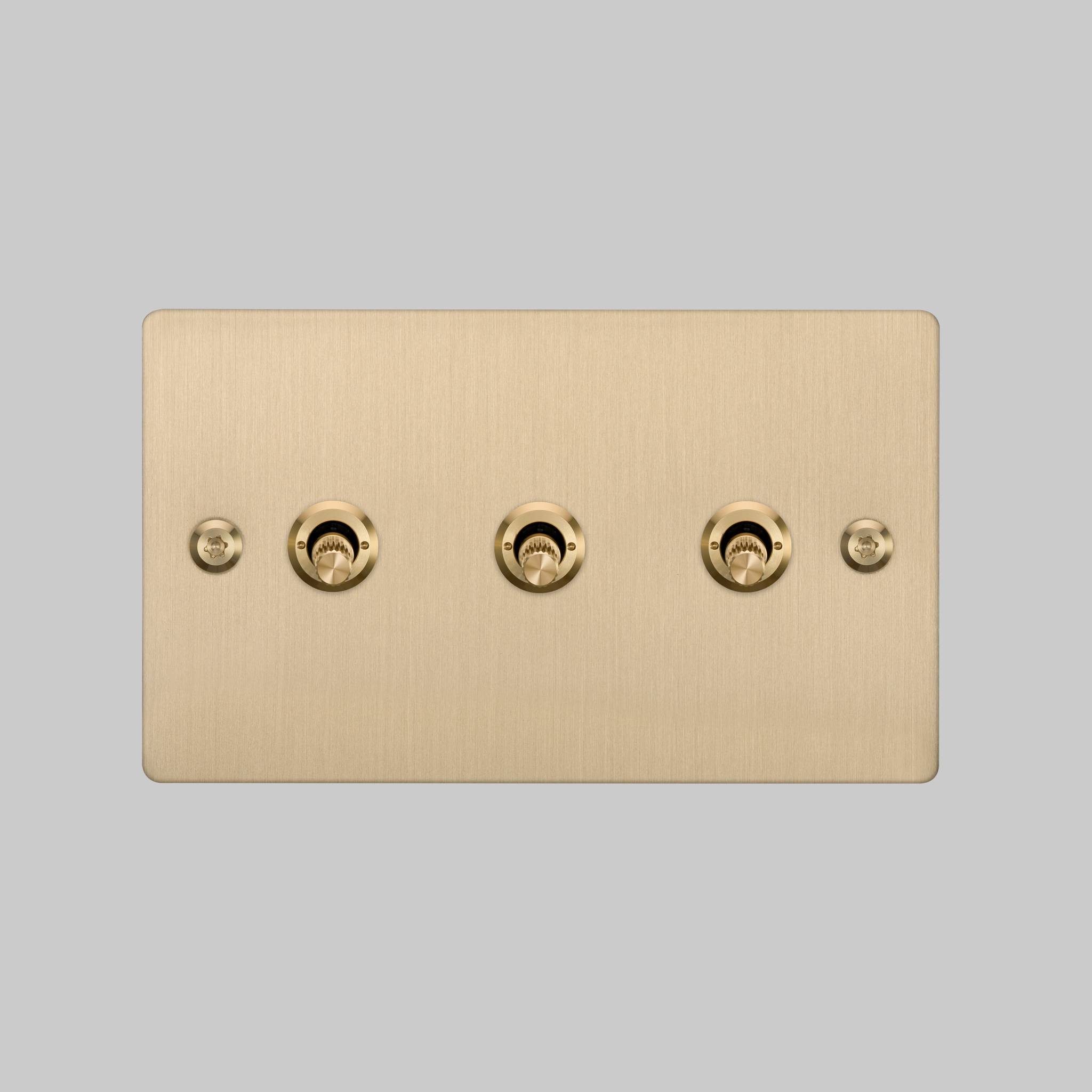 Buster + Punch 3G toggle switch, Brass plate with Brass linear knurl toggle arm, front elevation view