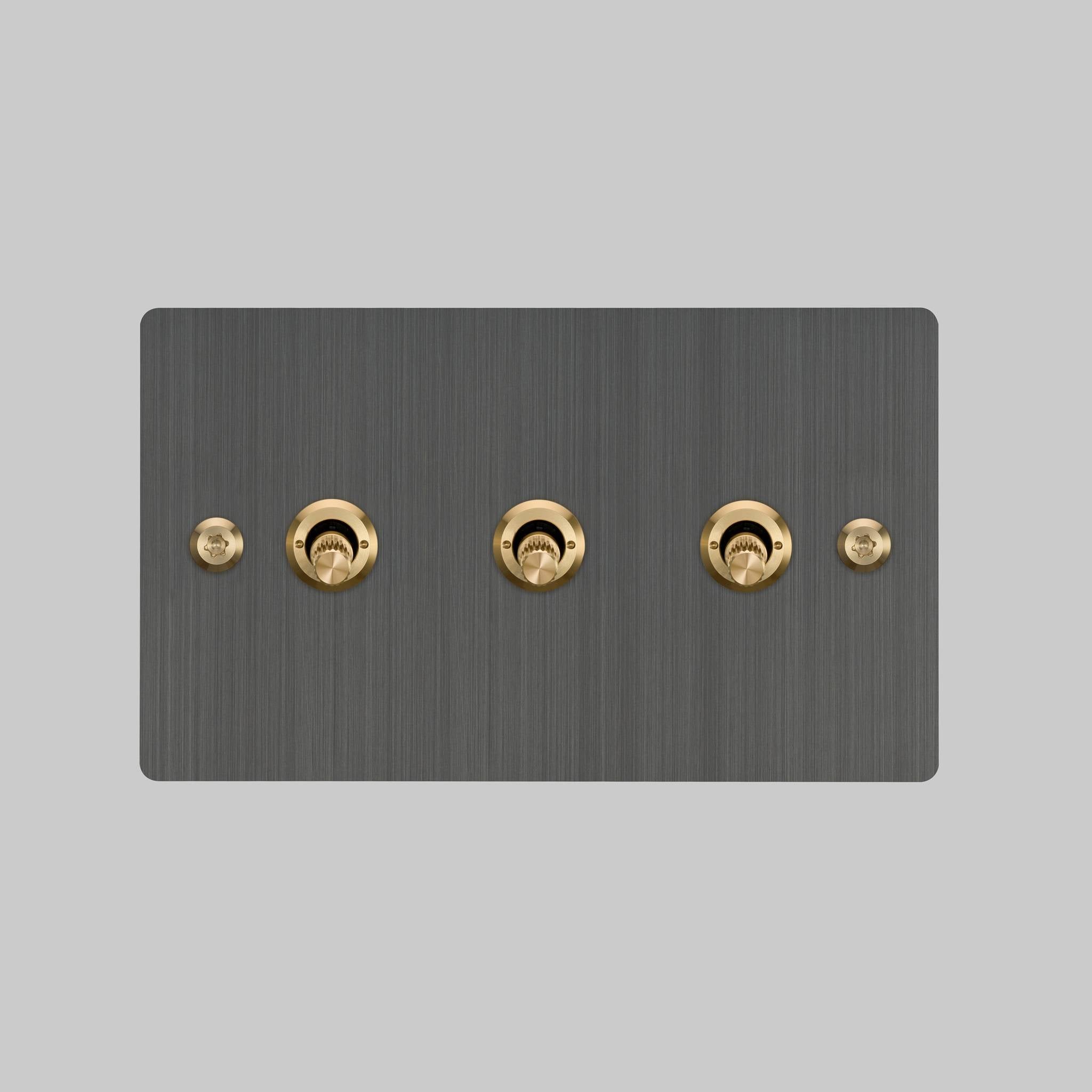 Buster + Punch 3G toggle switch, Smoked Bronze plate with Brass linear knurl toggle arm, front elevation view