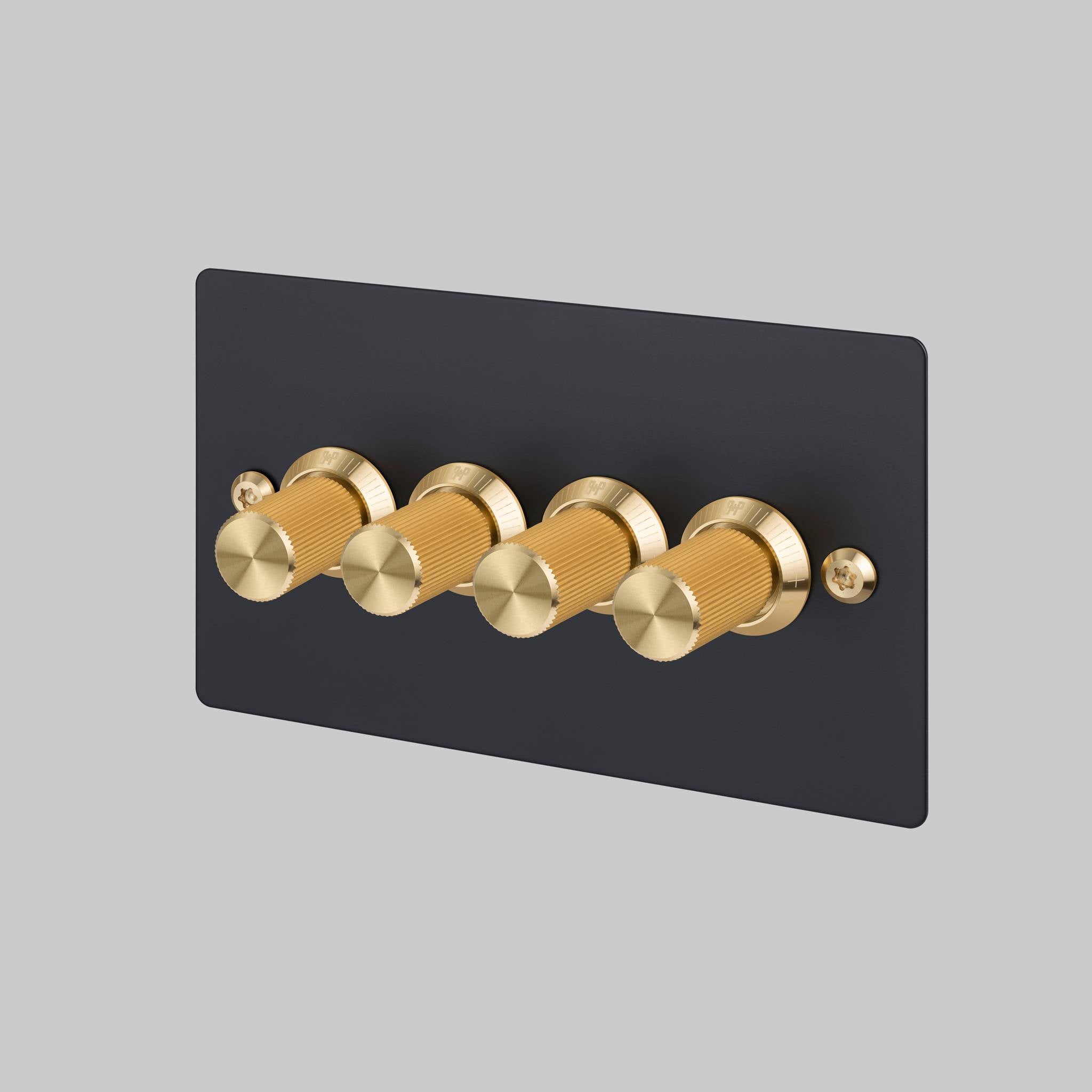 Buster + Punch 4G dimmer switch, Black plate with Brass linear knurl dimmer knob, front view