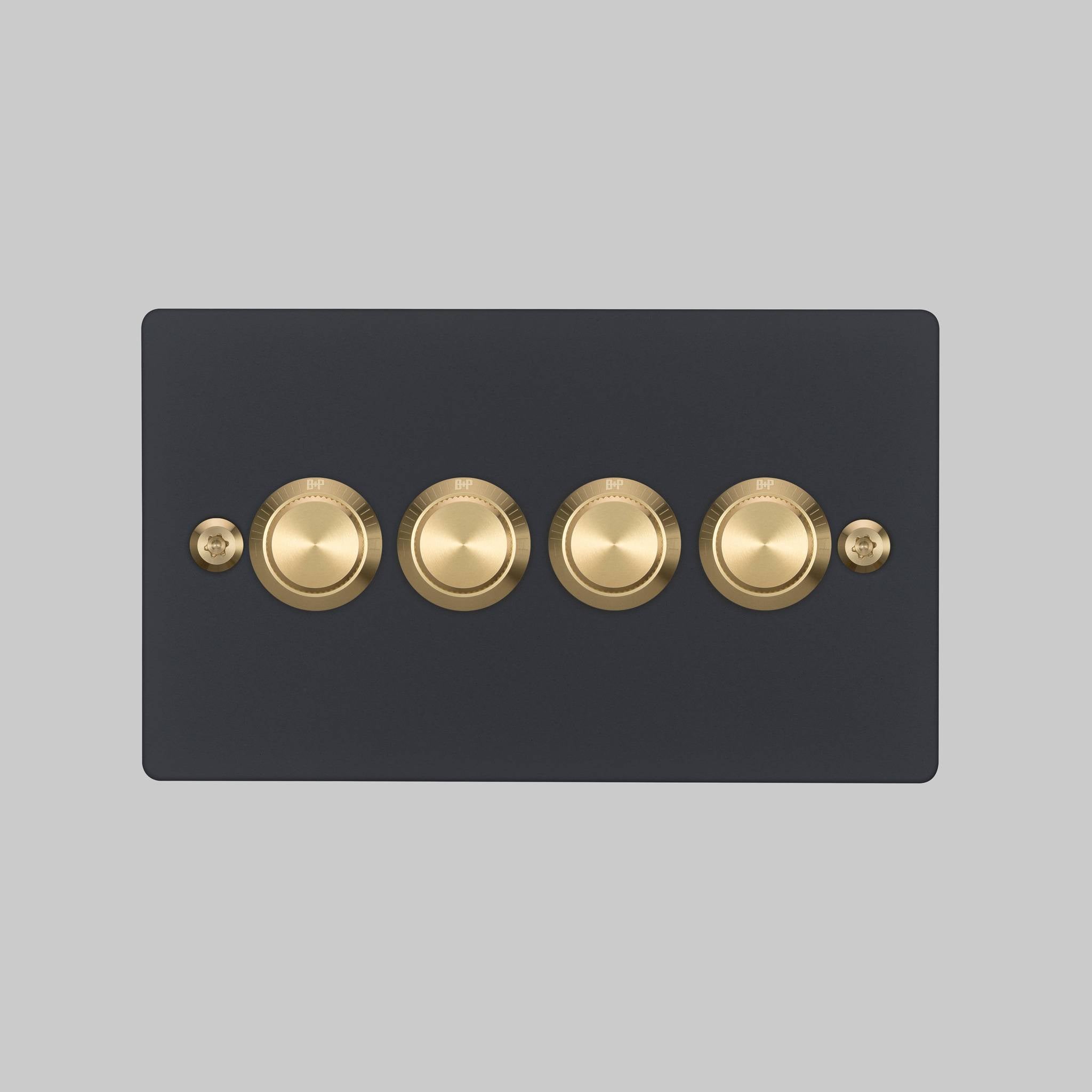 Buster + Punch 4G dimmer switch, Black plate with Brass linear knurl dimmer knob, elevated angle