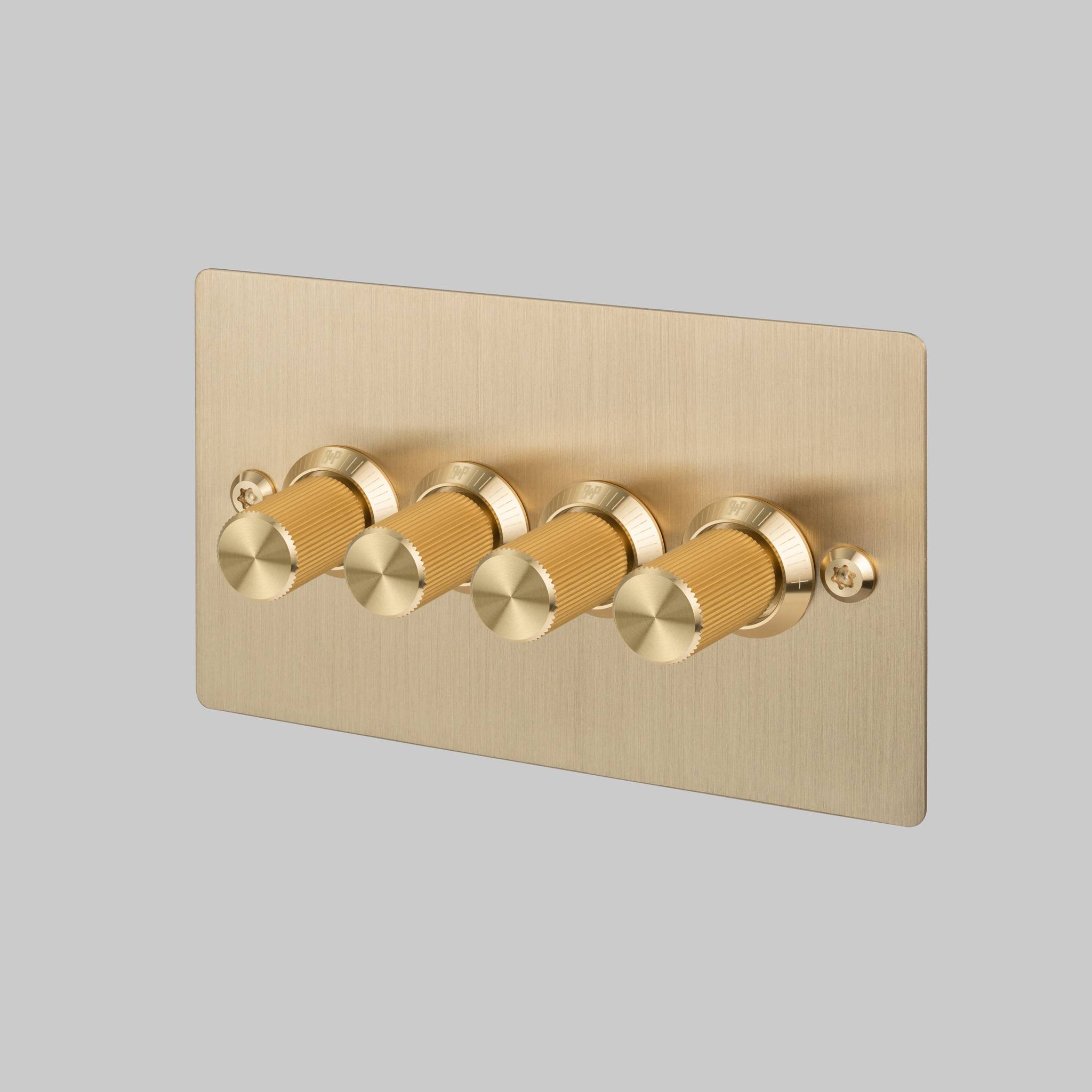 Buster + Punch 4G dimmer switch, Brass plate with Brass linear knurl dimmer knob, front view