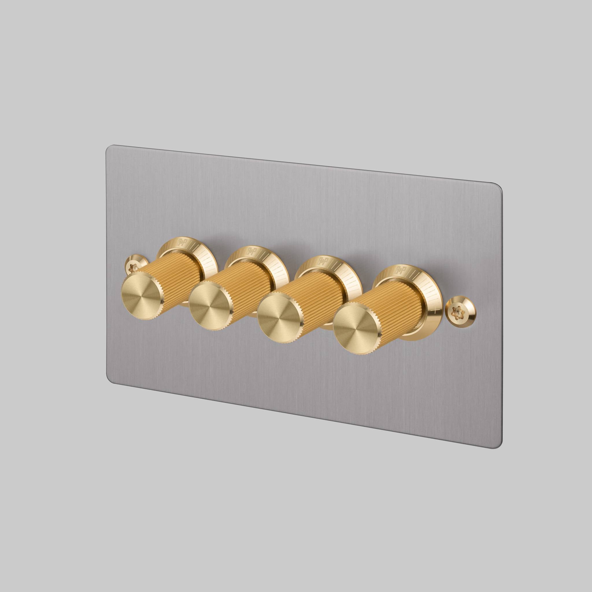 Buster + Punch 4G dimmer switch, Steel plate with Brass linear knurl dimmer knob, front view