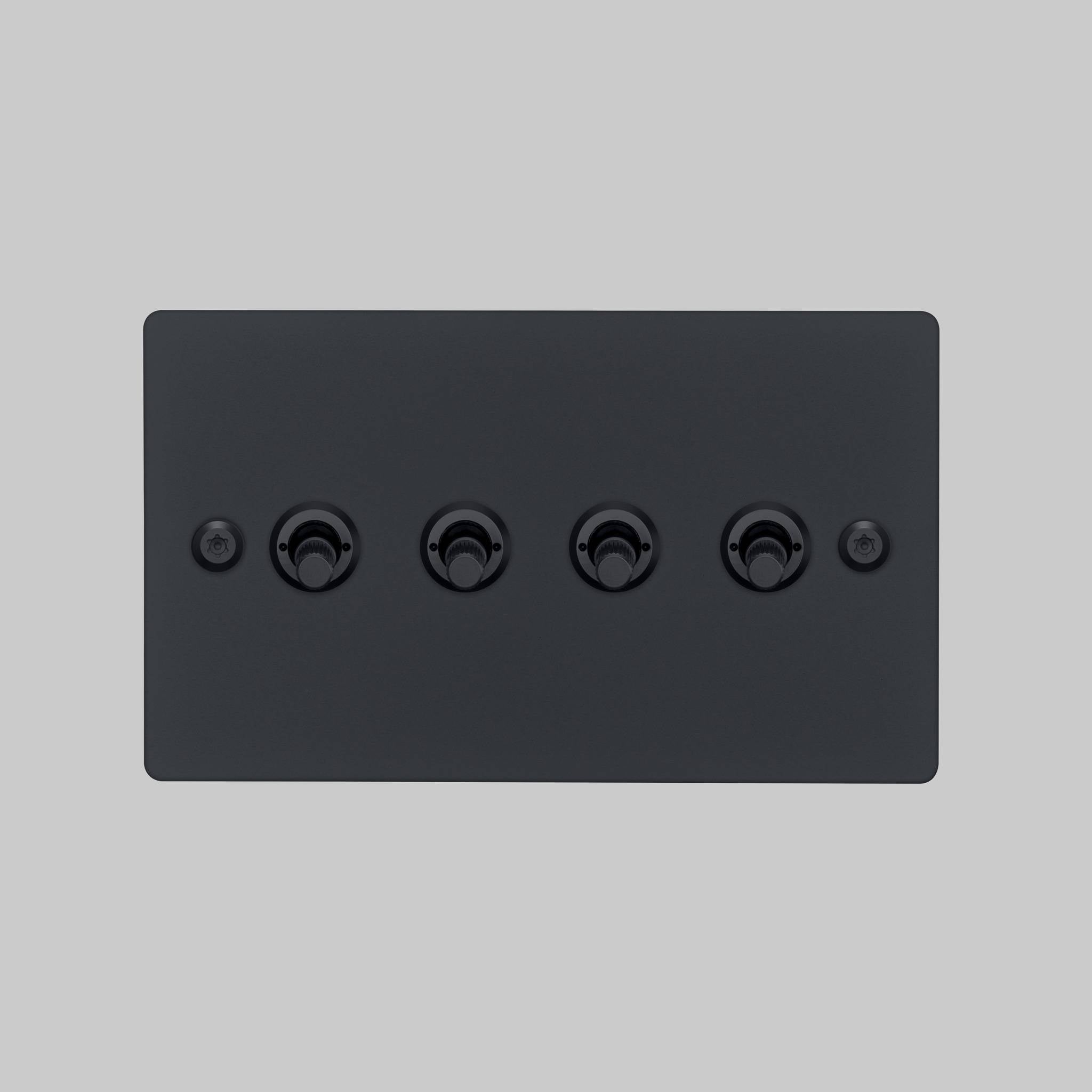 Buster + Punch 4G toggle switch, black plate with black linear knurl toggle arms, elevated angle view