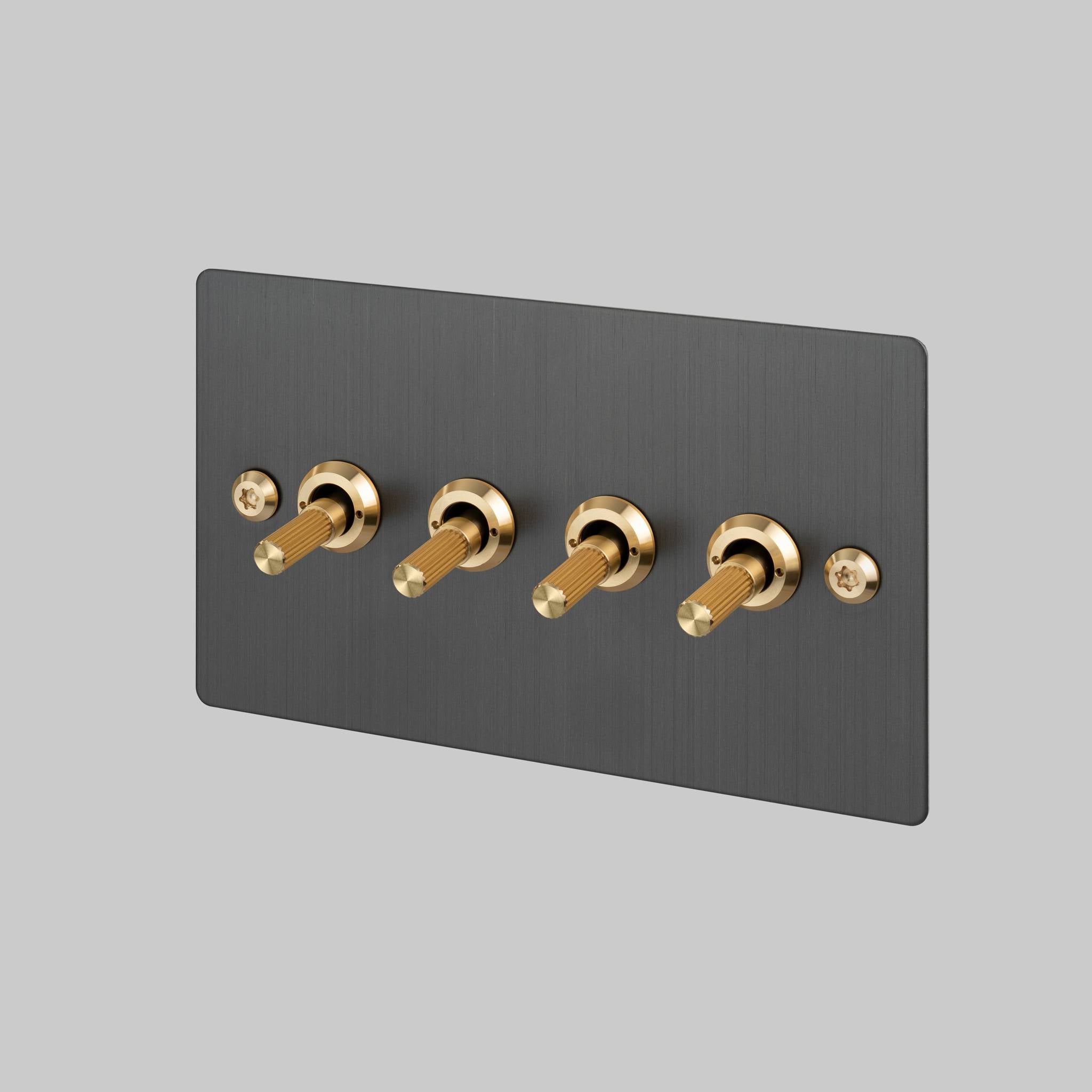 Buster + Punch 4G toggle switch, smoked bronze plate with brass linear knurl toggle arms, front view