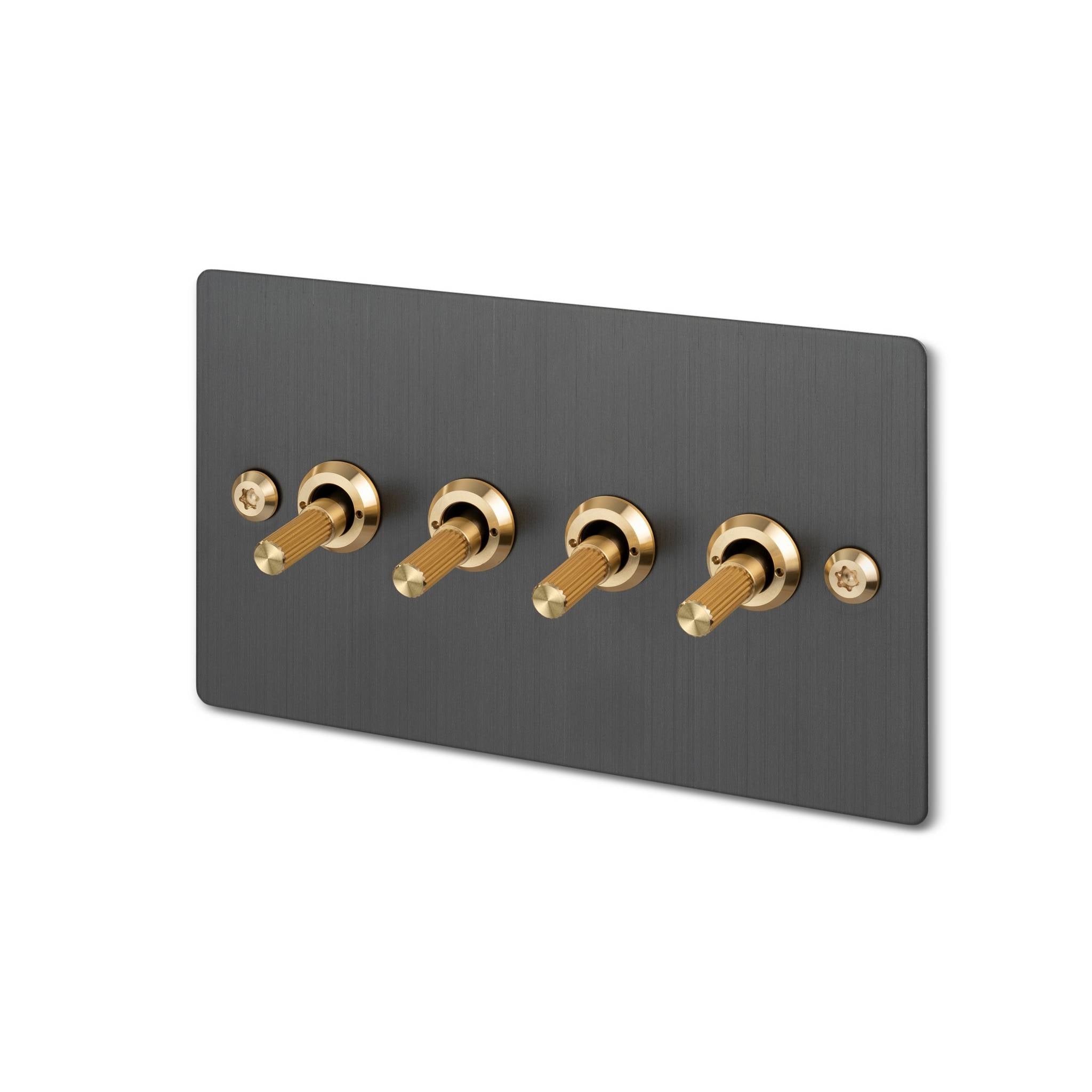 Buster + Punch 4G toggle switch, smoked bronze plate with brass linear knurl toggle arms, isolated cutout