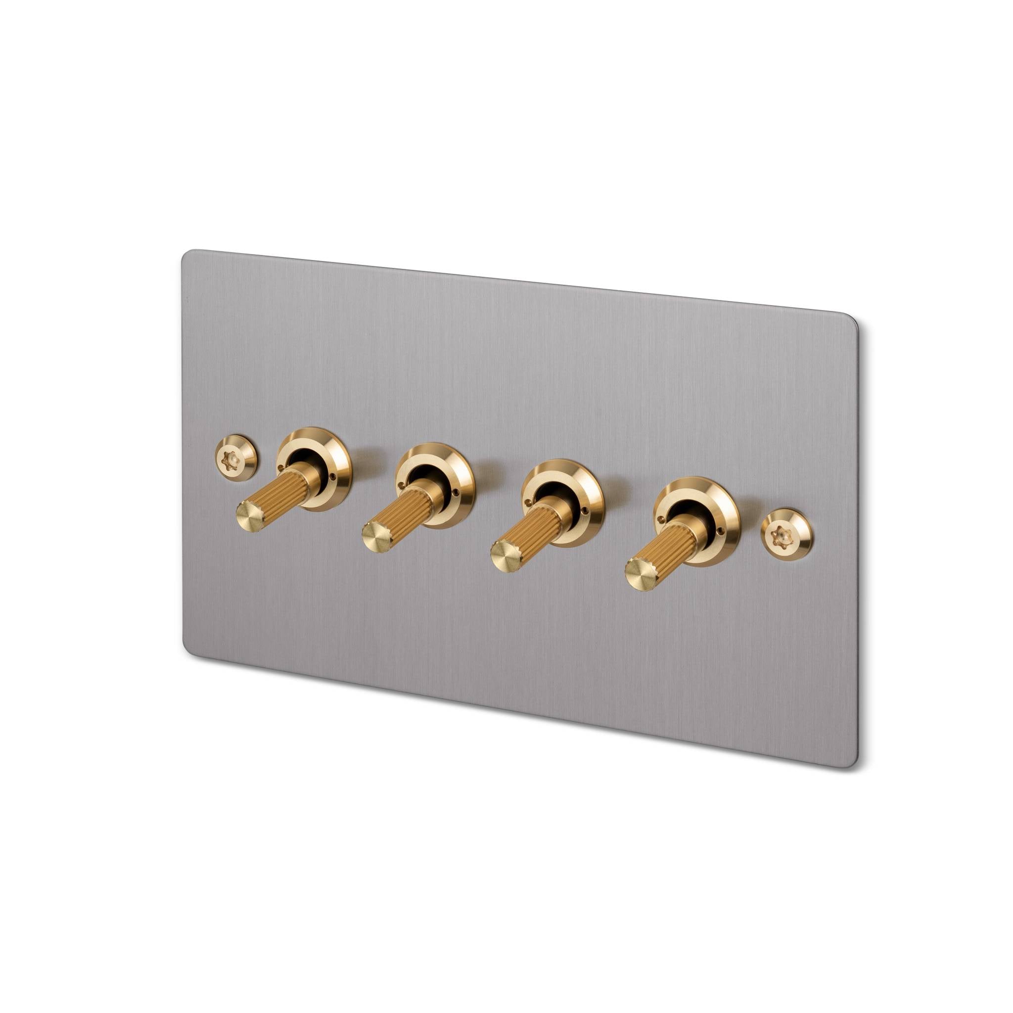 Buster + Punch 4G toggle switch, steel plate with brass linear knurl toggle arms, isolated cutout