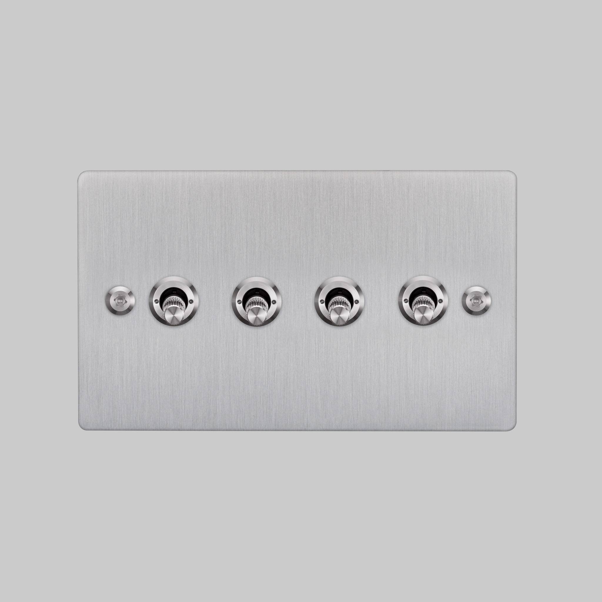 Buster + Punch 4G toggle switch, steel plate with steel linear knurl toggle arms, elevated angle view