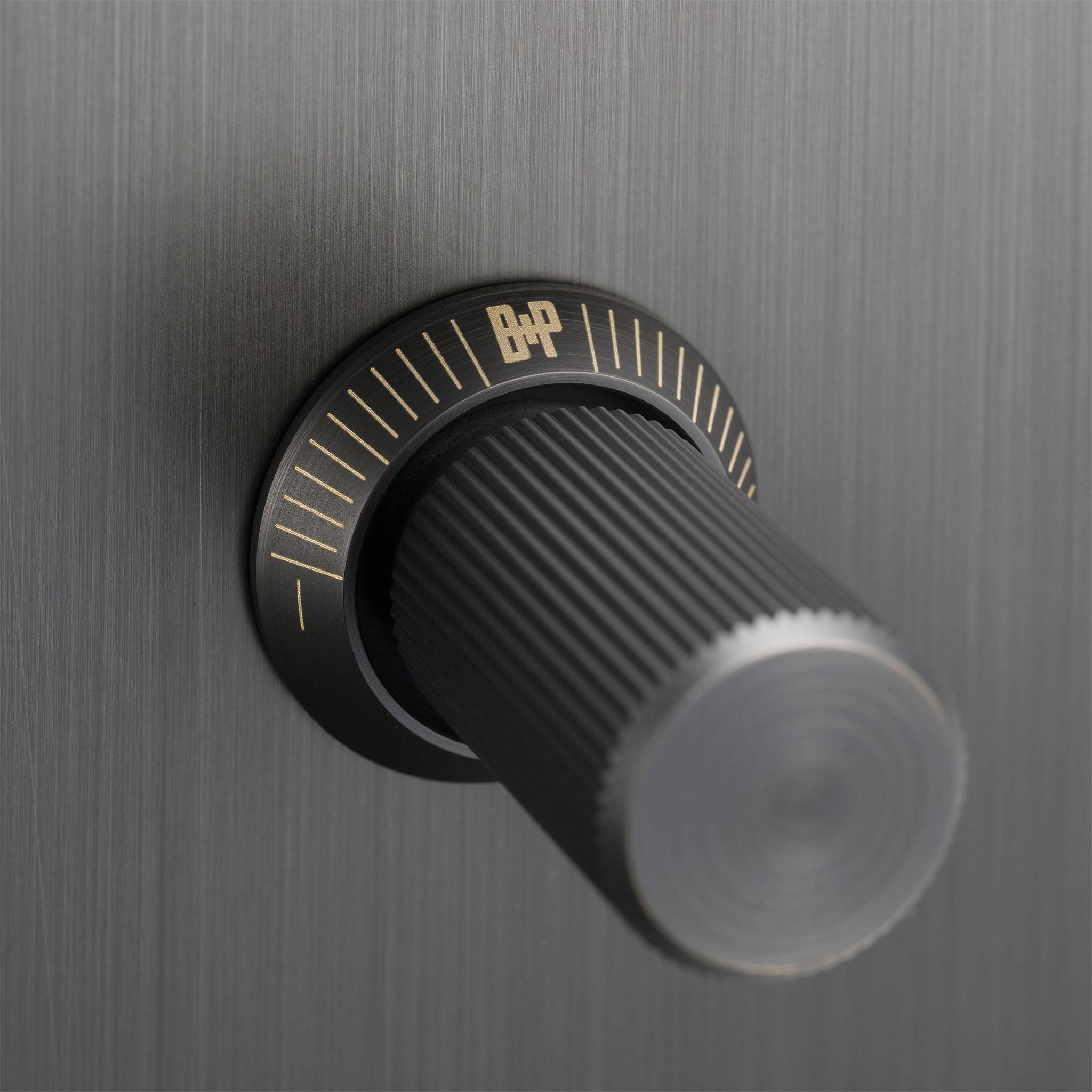 Buster + Punch 1G Dimmer switch, Smoked Bronze plate with Smoked Bronze linear knurl knob, close up of the knurl detail
