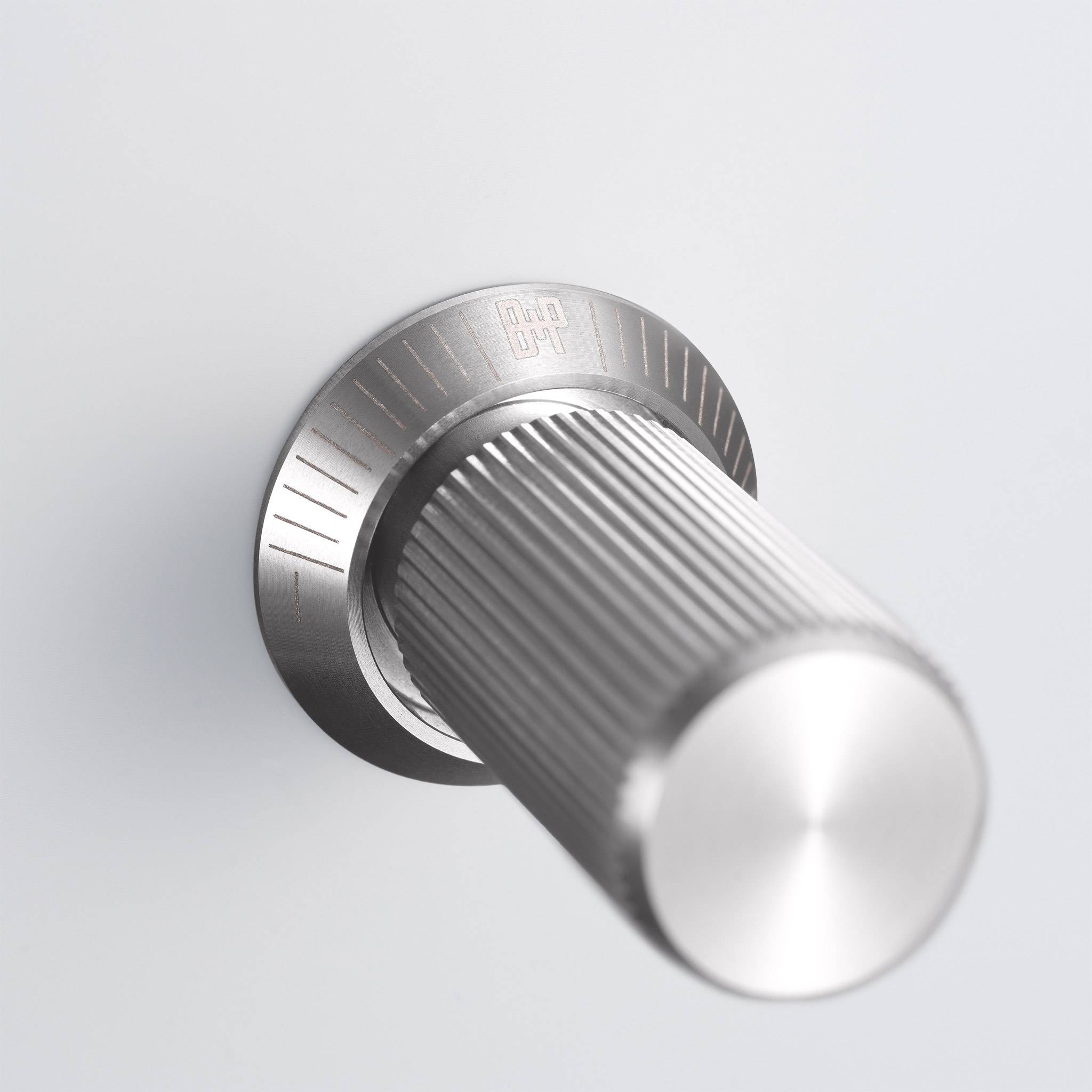 Buster + Punch 2G dimmer switch, white plate with steel linear knurl knob, close up of the knob detail