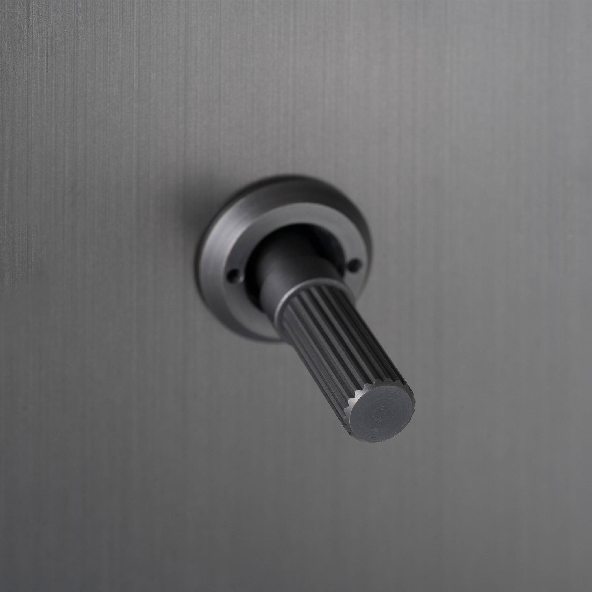 Buster + Punch 3G toggle switch, close up of the Smoked Bronze linear knurl toggle arm detail
