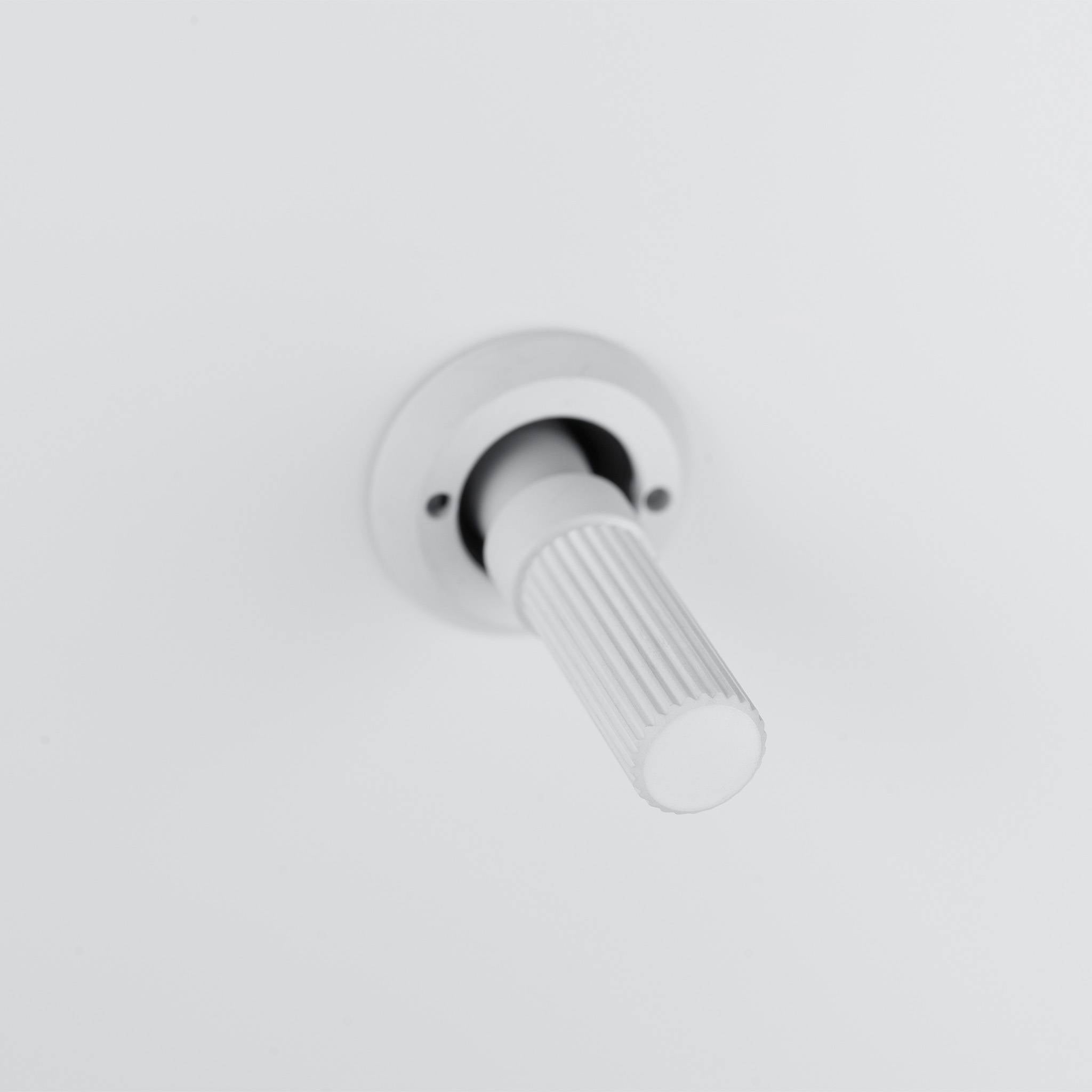Buster + Punch 3G 2-way toggle switch, White plate with White linear knurl toggle arm, close up of the knurl detail