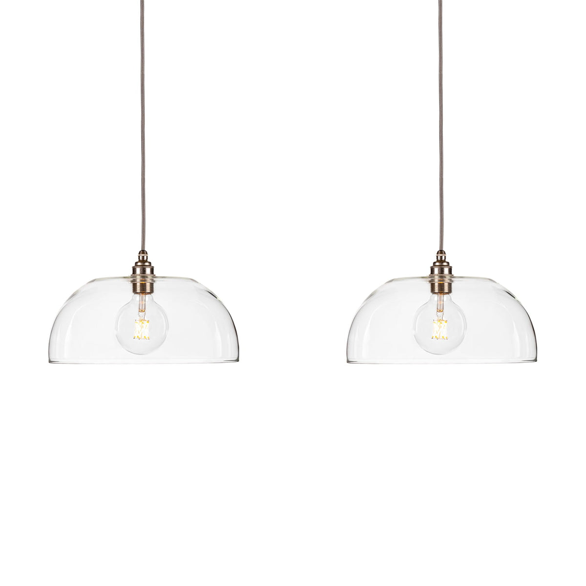Leverint Jubilee Linear Flush Cluster 2 Way, two clear glass dome pendants with filament bulbs on grey fabric flex, studio shot on white