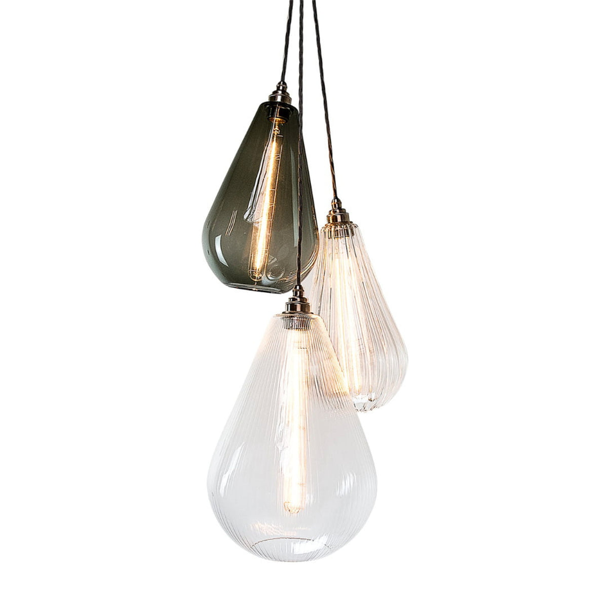 Leverint Kingston vertical cluster of three hand blown teardrop pendants, one smoked grey and two clear ribbed, with nickel toned lamp holders and long filament bulbs, studio shot on white