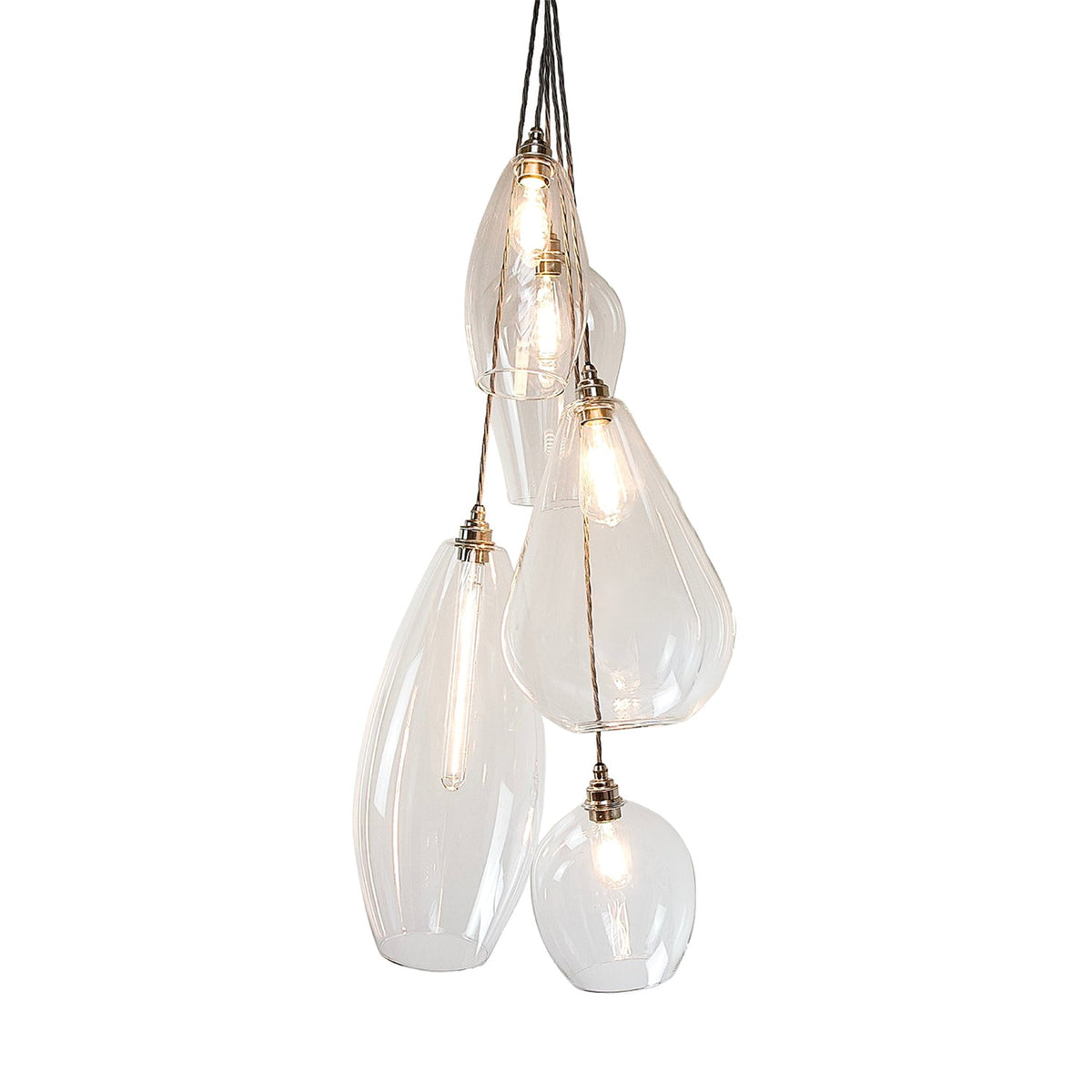 Leverint Mixed Vertical Cluster 5 Way, five clear hand blown glass pendants in different shapes hanging at different heights with nickel toned lamp holders, studio shot on white