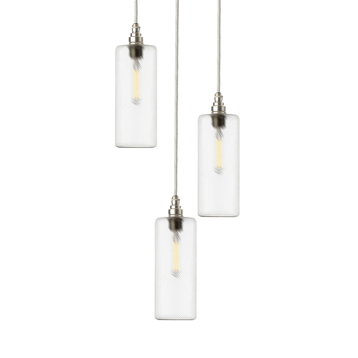 Leverint Piccadilly Cascade Cluster 3 Way with three slim clear finely ribbed glass cylinder pendants at staggered heights, satin nickel toned lamp holders and pale grey fabric flex, studio shot on white