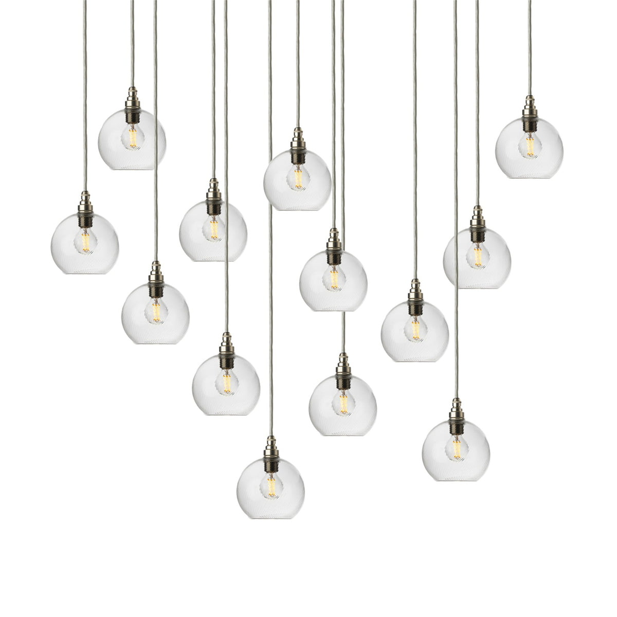 Leverint Pimlico cascade cluster of thirteen clear twist ribbed glass globe pendants at different heights on light grey cables with silver toned lamp holders, studio shot on white