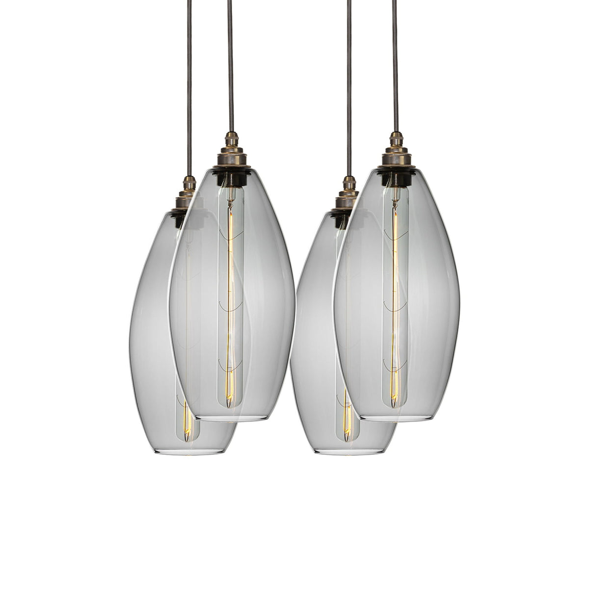 Leverint Victoria Flush Cluster 4 Way, studio shot on white of four slim oval smoky grey glass pendants in two overlapping pairs with aged brass lamp holders and long tubular filament bulbs