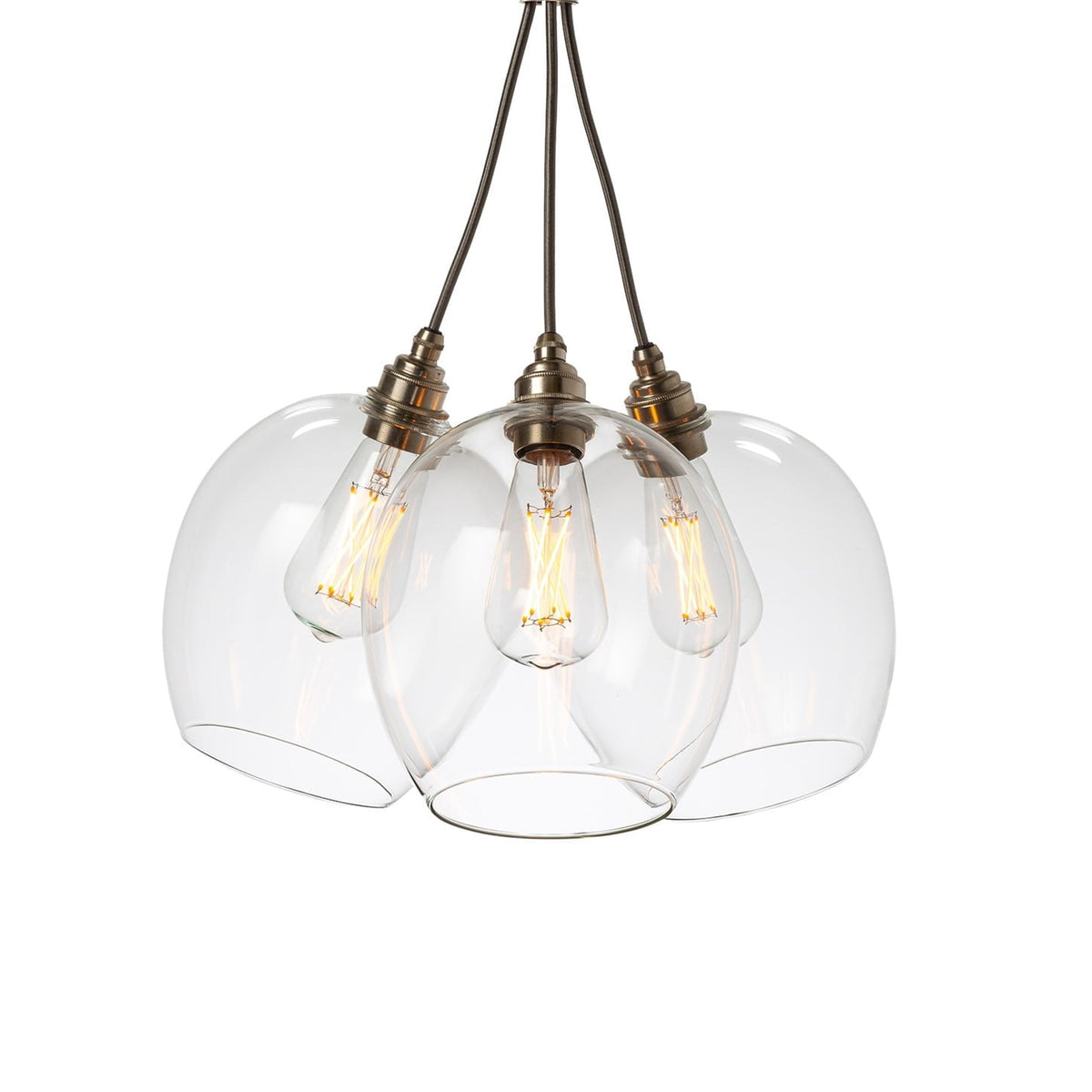 Leverint Wimbledon Bunched Cluster 3 Way with three clear glass dome pendants hung together, brass toned lamp holders, grey fabric flex and filament bulbs, studio shot on white